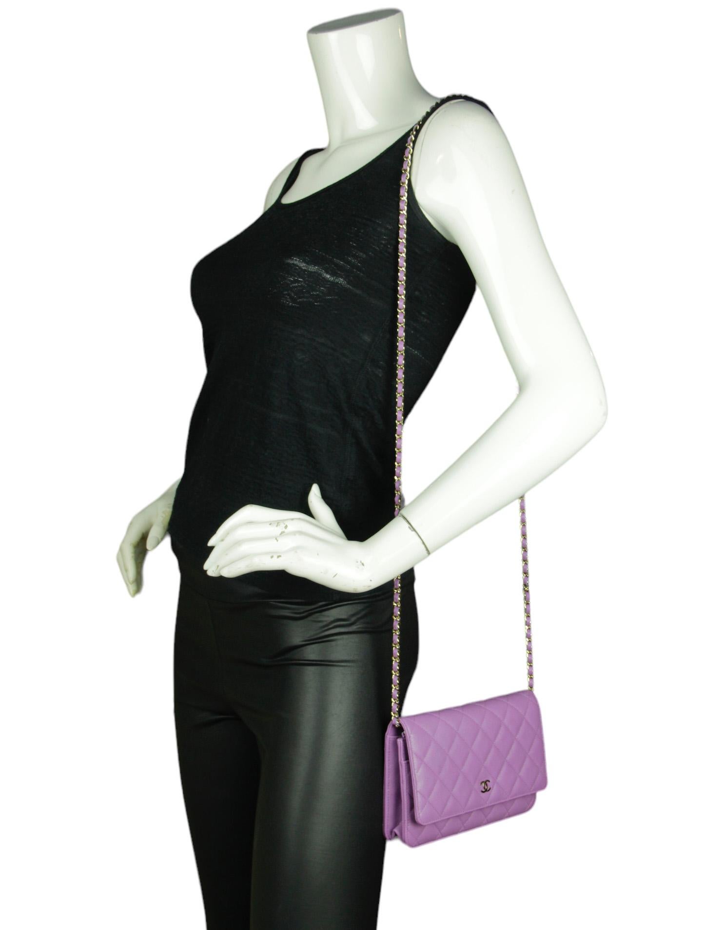 Bag. Chain can be tucked inside bag to also be worn as a clutch. 
Made In: France
Year of Production: 2022
Color: Viole purple
Hardware: Light goldtone
Materials: Caviar leather
Lining: Purple leather and grosgrain
Closure/Opening: Flap top with