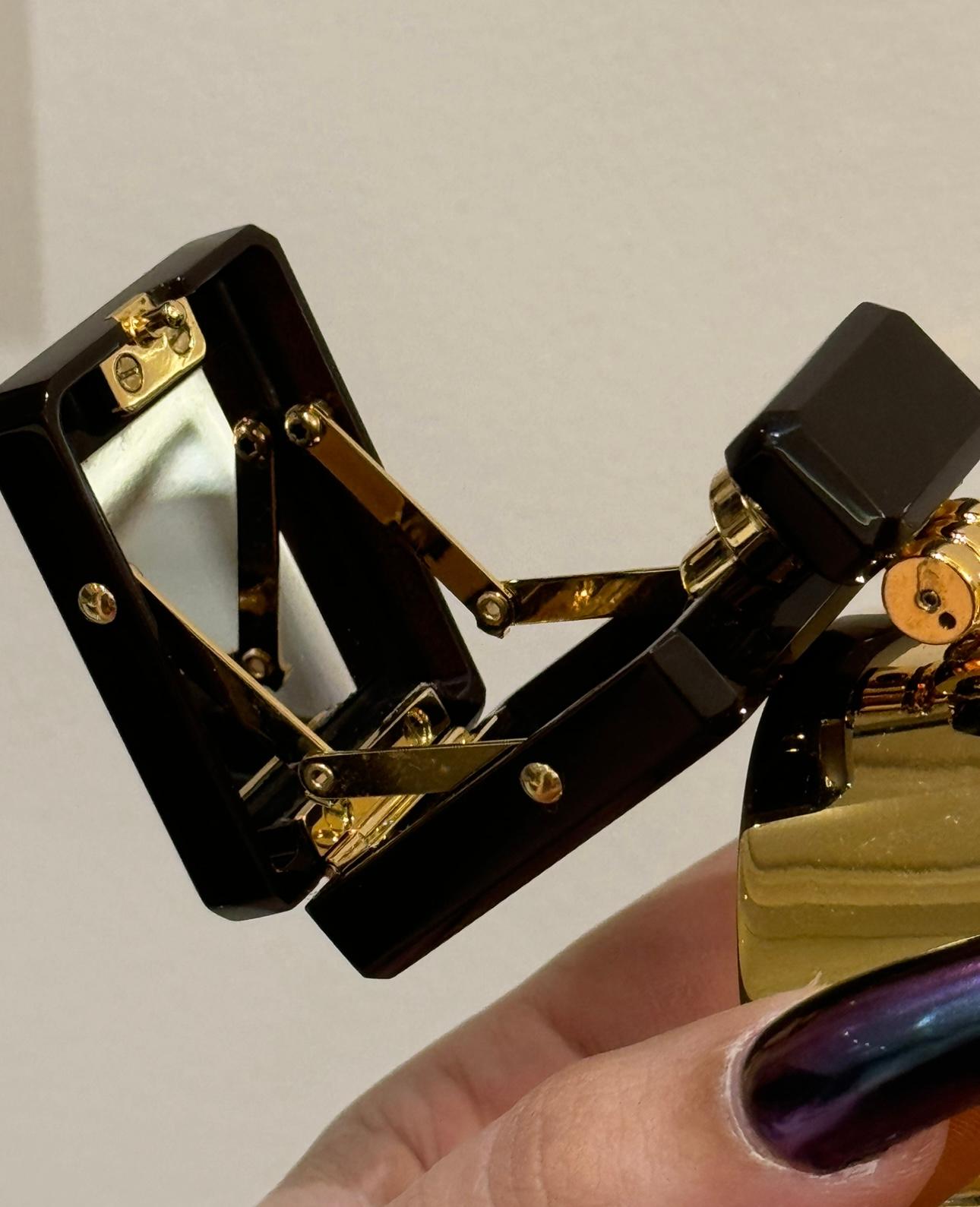 Chanel runway sample (no stamp) 2022 cuff bracelet featuring a micro minaudière with the shape of the Chanel perfume bottle, mirror inside, standard wrist, gold metal. 