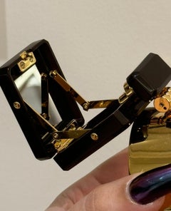 Chanel 2022 runway cuff bracelet featuring a micro minaudière with mirror