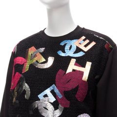 CHANEL 2022 Runway metallic CC logo graphic black tweed crew sweater FR34 XS