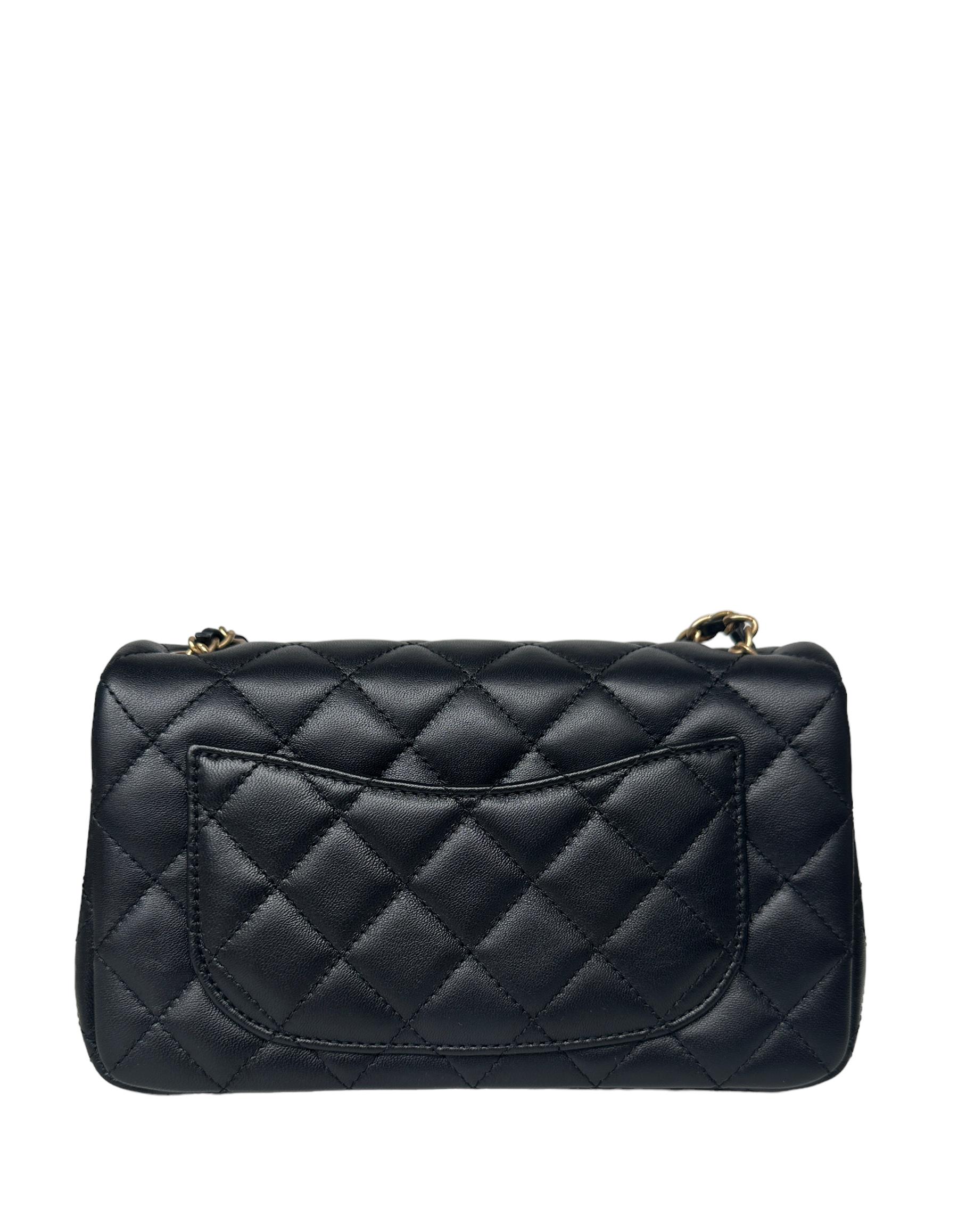 Chanel Black Lambskin Quilted Rectangular CC Pearl Crush Mini Flap Bag

Made In: Italy
Year of Production: 2023
Color: Black
Hardware: Goldtone
Materials: Lambskin leather
Lining: Smooth leather
Closure/Opening: Flap top with CC twist lock
Exterior