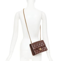 CHANEL 2023 burgundy quilted lambskin ornate CC turnlock seasonal mini flap bag