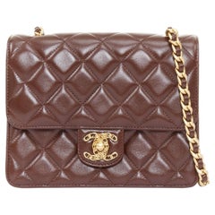 CHANEL 2023 burgundy quilted lambskin ornate CC turnlock seasonal mini flap bag