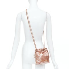 CHANEL 2023 Runway 22 Mini metallic calfskin leather drawstring hobo bag