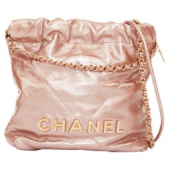 CHANEL 2023 Runway 22 Mini metallic calfskin leather drawstring hobo bag