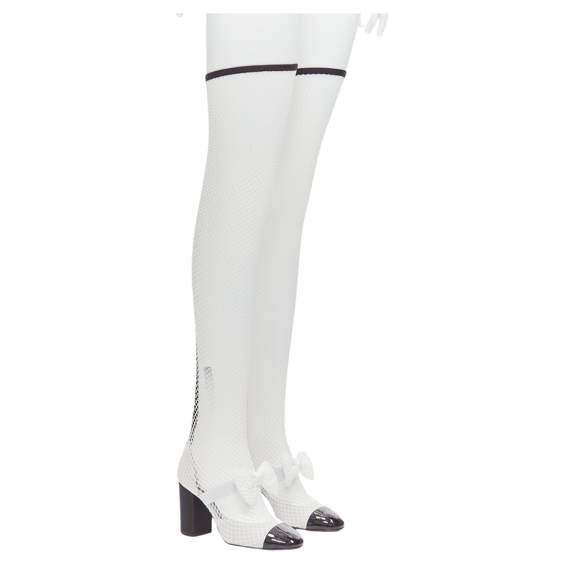 CHANEL 2023 Runway black toe cap white bow CC fishnet thigh high heels EU38.5 For Sale