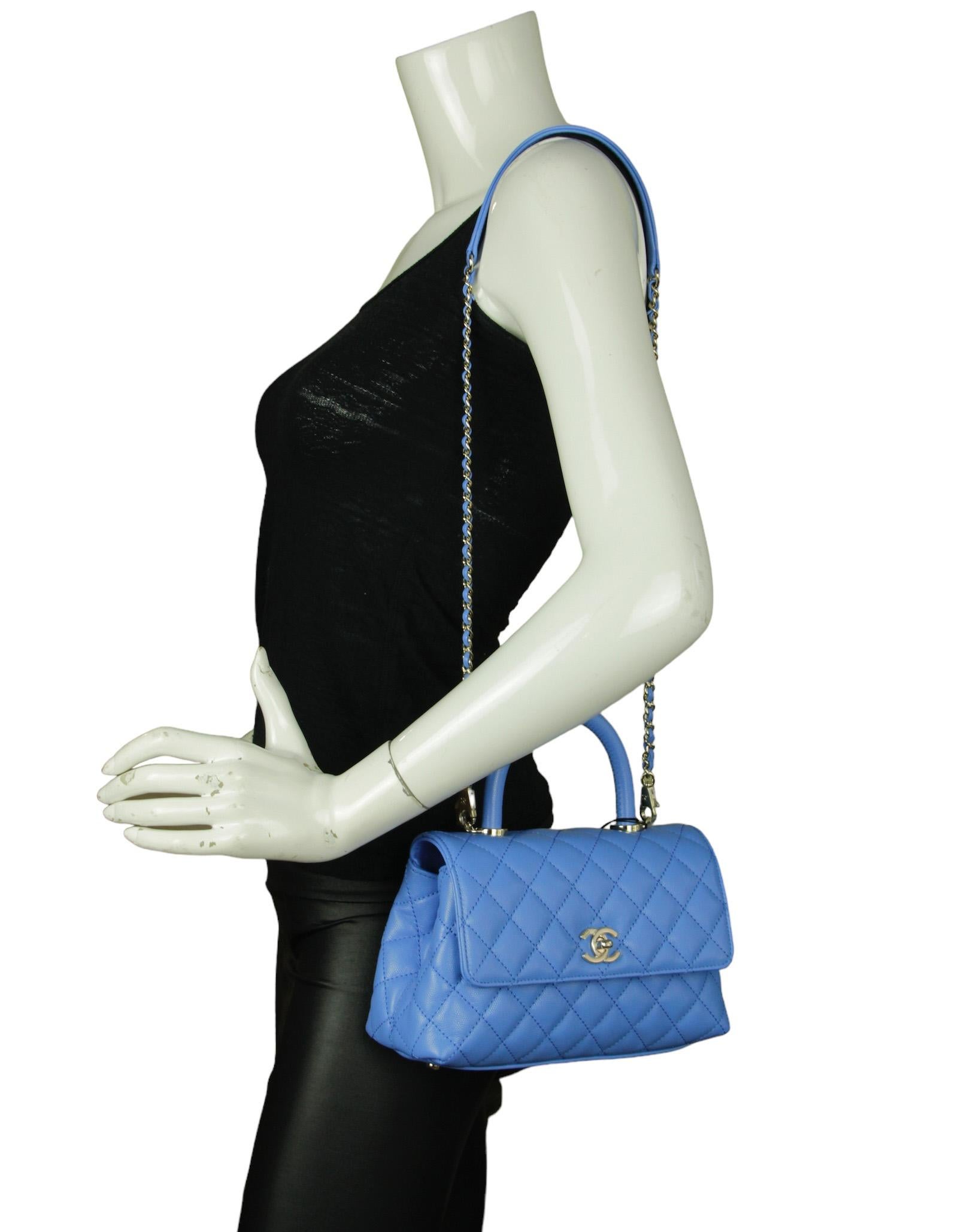 Chanel Blue Caviar Leather Quilted Mini Coco Handle Flap Bag

Made In: Italy
Year of Production: 2024
Color: Blue
Hardware: Pale goldtone
Materials: Caviar leather
Lining: Leather
Closure/Opening: Flap top with CC twist lock
Exterior Pockets: Back