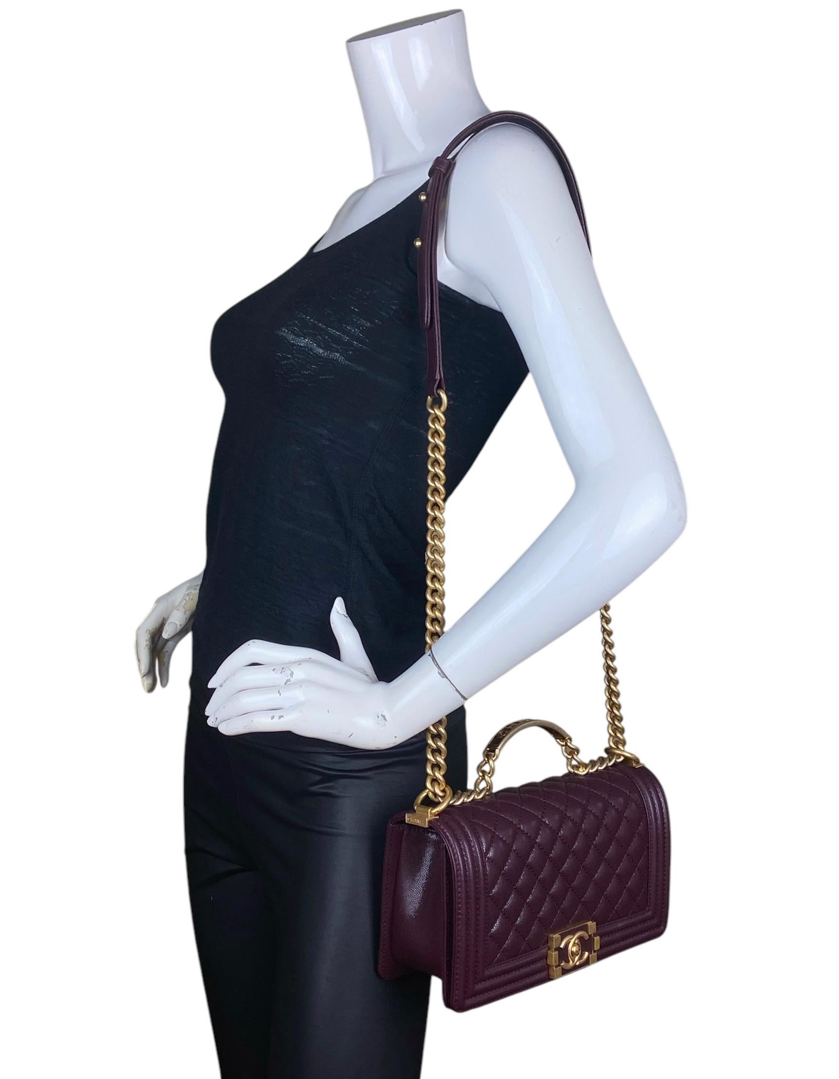 Chanel 2024 Burgundy Caviar Quilted Medium Top Handle Boy Bag   

Made In: France
Year of Production: 2024
Color: Burgundy
Hardware: Goldtone
Materials: Caviar leather
Lining: Leather
Closure/Opening: Flap top with pushlock
Exterior Pockets: