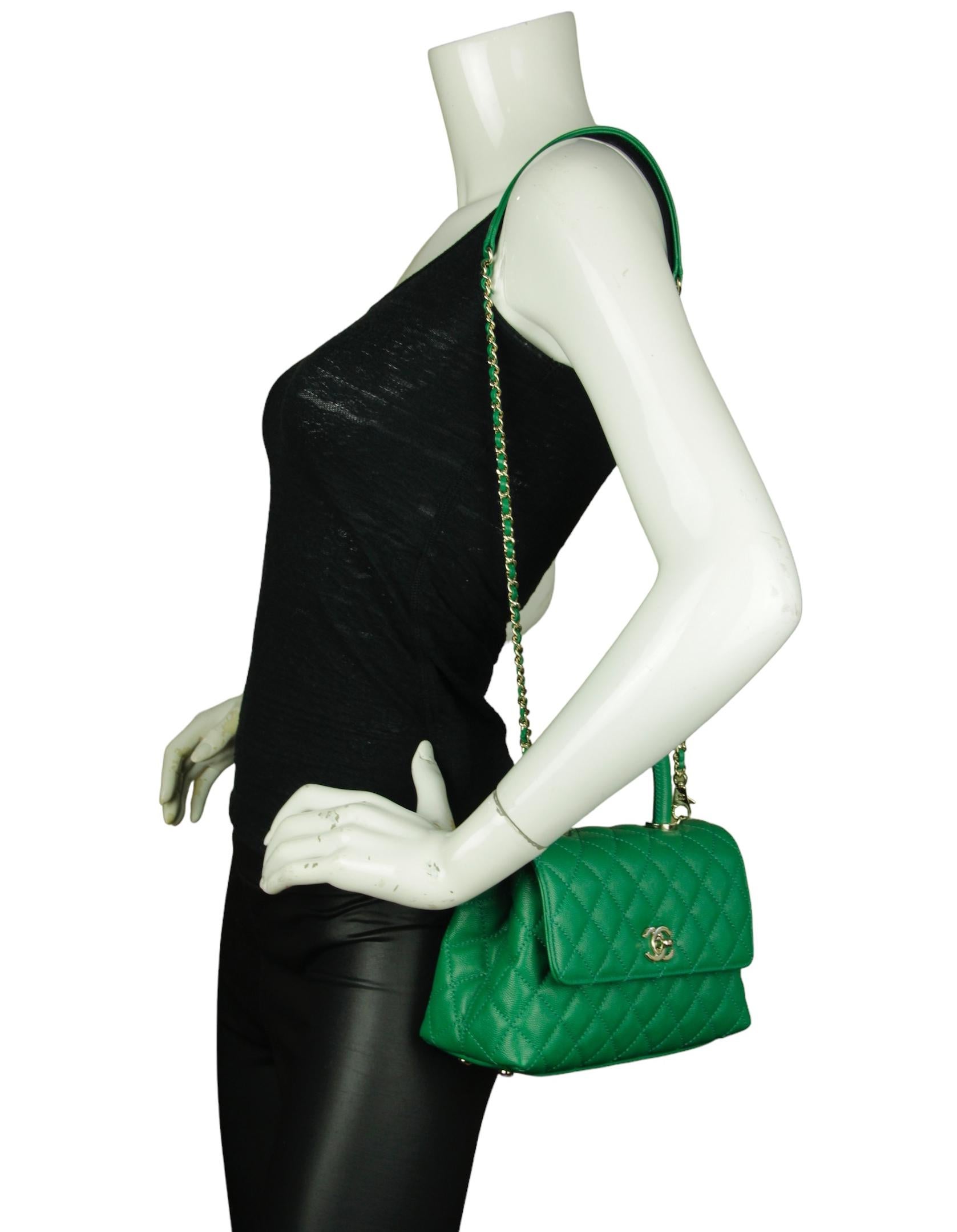 Chanel Green Caviar Leather Quilted Mini Coco Handle Flap Bag

Made In: Italy
Year of Production: 2024
Color: Green
Hardware: Pale goldtone
Materials: Caviar leather
Lining: Leather
Closure/Opening: Flap top with CC twist lock
Exterior Pockets: Back