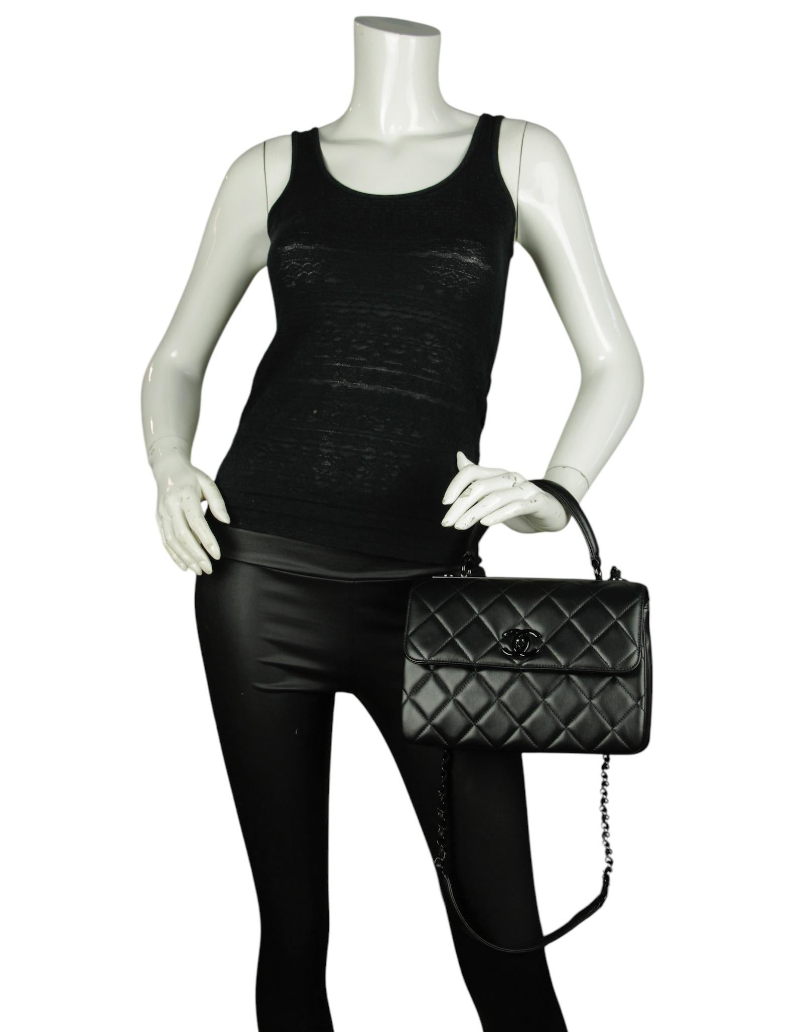 Chanel 2024 So Black Lambskin Quilted Small Trendy CC Dual Handle Flap Bag

Made In: Italy
Year of Production: 2024
Color: Black
Hardware: Black
Materials: Lambskin
Lining: Burgundy leather 
Closure/Opening: Flap top with CC twistlock
Exterior