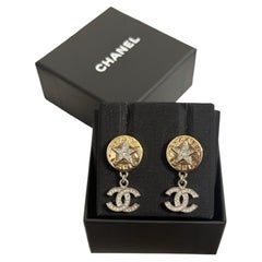 CHANEL 2025 Gold Star Button Crystal CC Dangle Earrings