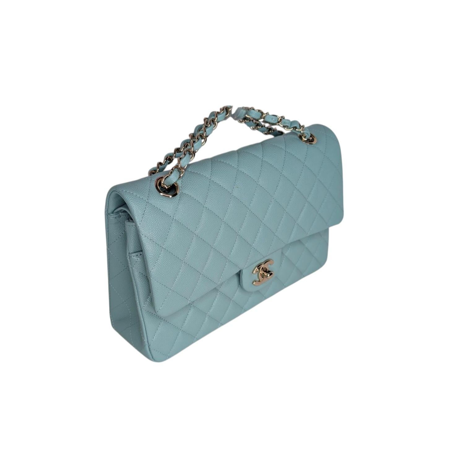 From the 2020 Cruise Collection; this classic shoulder bag is crafted of diamond quilted Caviar leather in light blue. This bag features a leather-threaded polished light gold chain shoulder strap, a flat rear pocket, and a light gold CC turn-lock