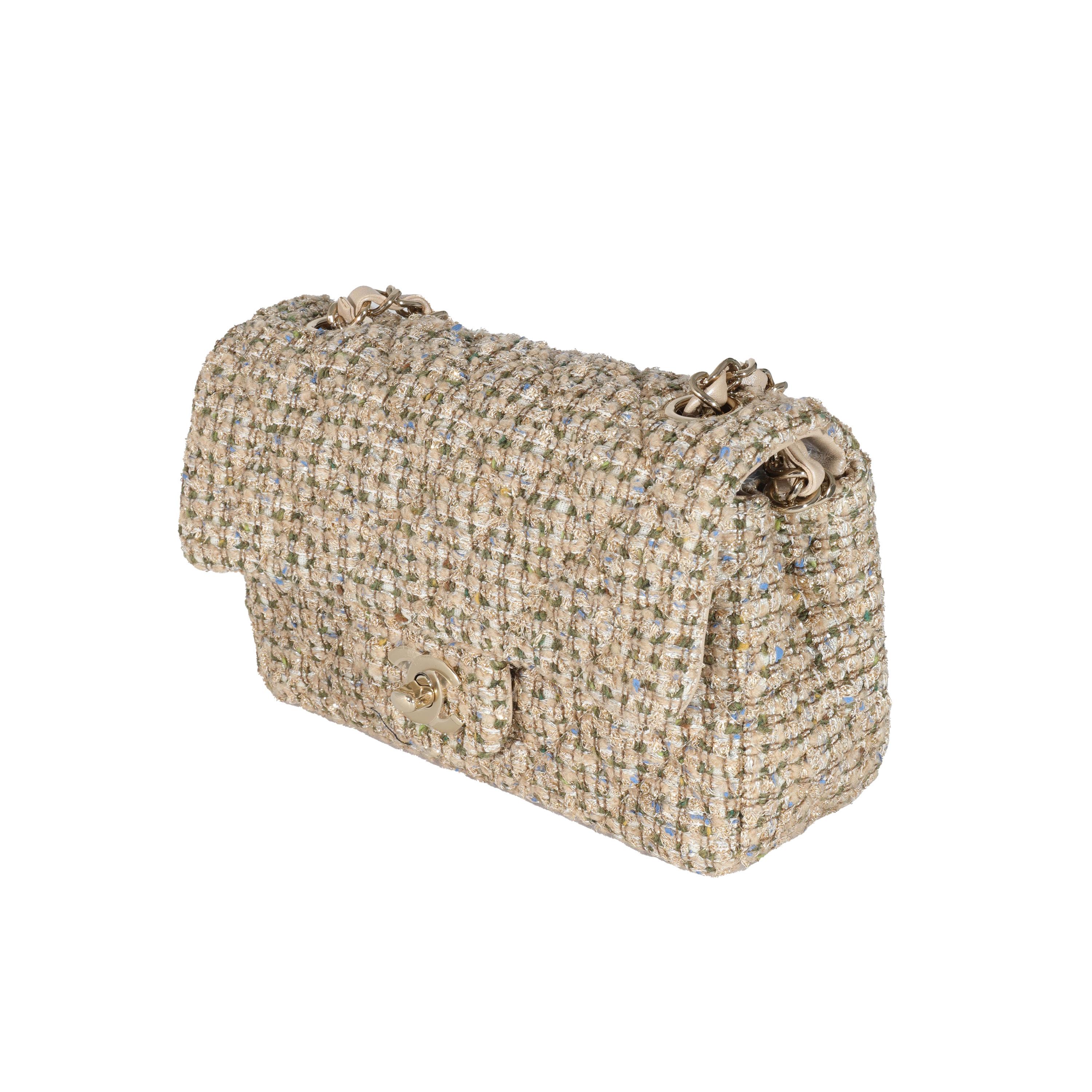 Listing Title: Chanel 21A Gold Tweed Mini Rectangular Flap Bag
SKU: 131579
Condition: Pre-owned 
Condition Description: A timeless classic that never goes out of style, the flap bag from Chanel dates back to 1955 and has seen a number of updates.