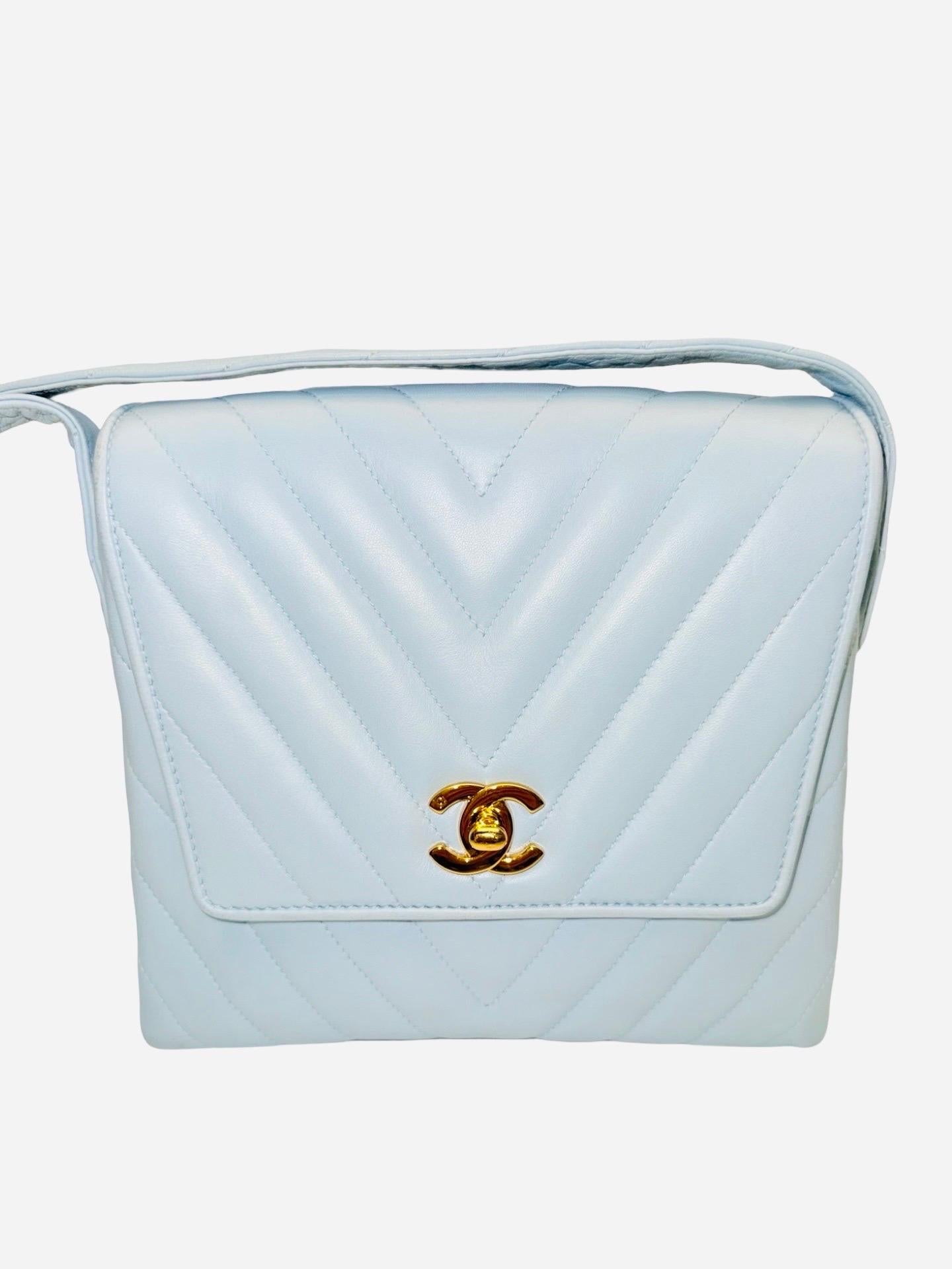 - Chanel 21cm light blue chevron lambskin shoulder bag from 1994 -1996 collection. 

- CC gold hardware turn lock. 

- One zip interior pocket. One interior slip pocket. 

- Have authenticity card, booklet and serial sticker. 

- Width: around 21cm