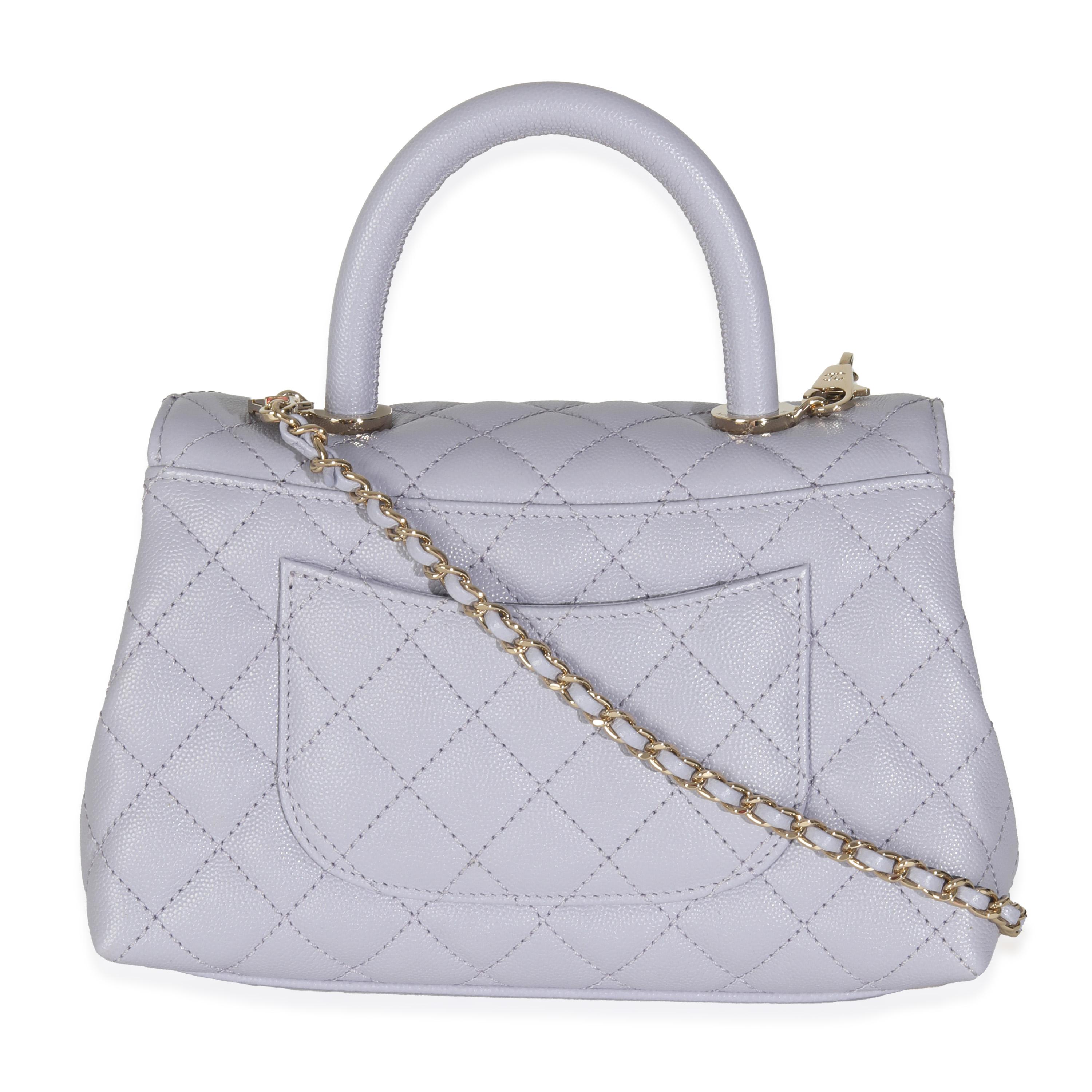 Listing Title: Chanel 21K Purple Quilted Caviar Mini Coco Handle Flap Bag
SKU: 145955
Condition: Pre-owned 
Condition Description: A timeless classic that never goes out of style, the flap bag from Chanel dates back to 1955 and has seen a number of