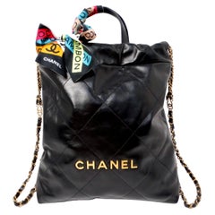 Chanel 22 Black Shiny Calfskin Backpack With Gold-Tone Hardware & Twill