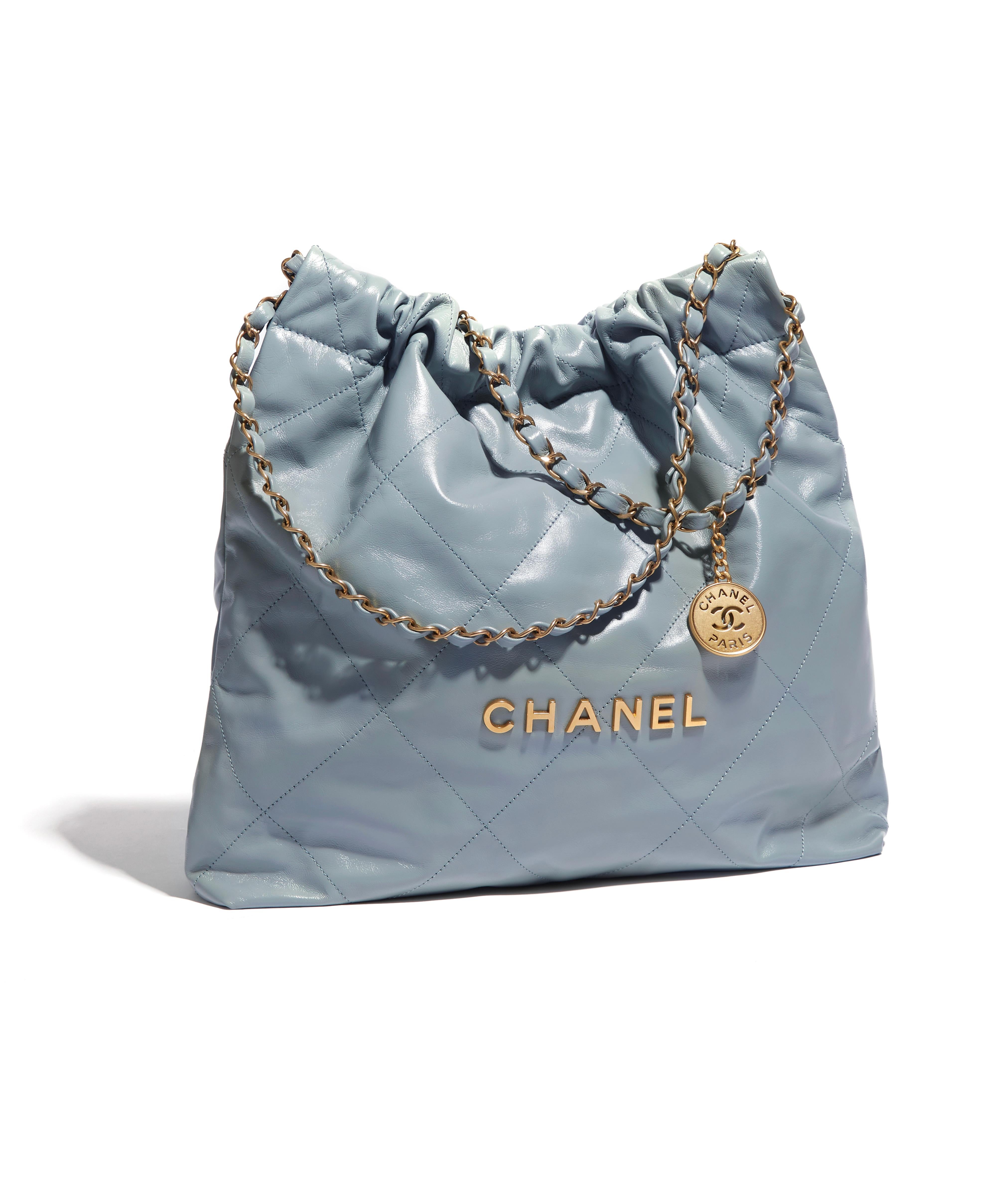 From Chanel's 2022 Spring Ready-to-Wear collection comes this beautiful new model. The Chanel 22 handbag comes in a shiny calf calfskin and gold-tone metal hardware. This piece comes in a hard-to-find light blue colour that is the perfect for the