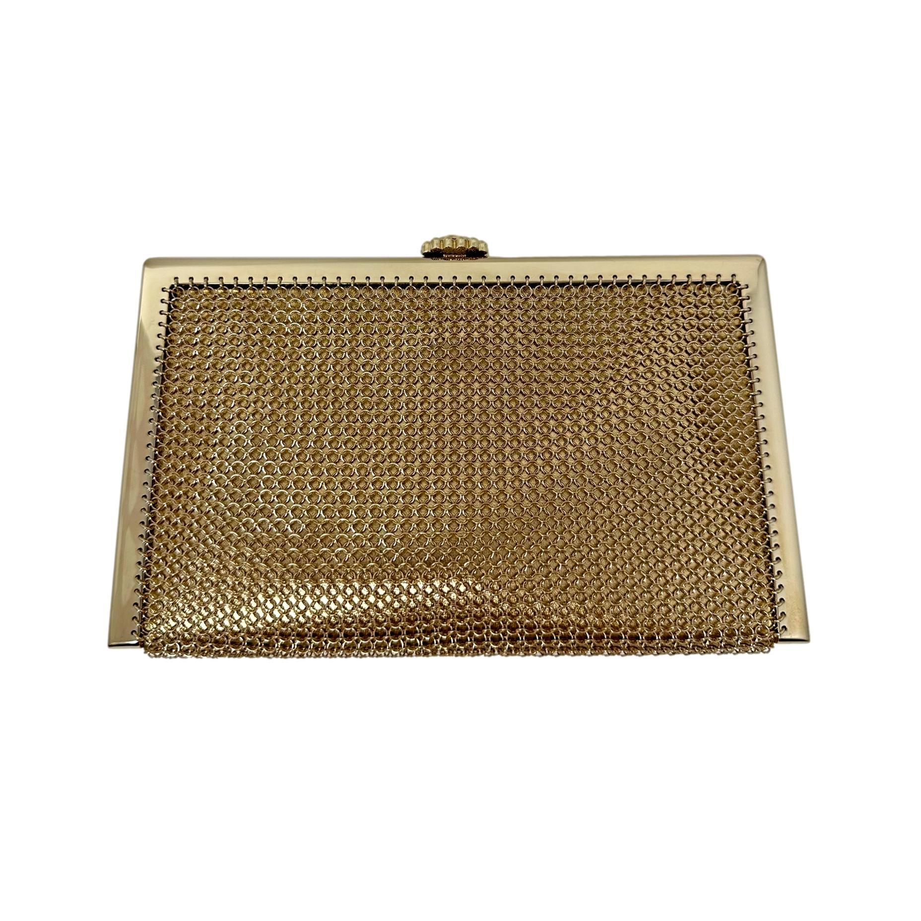 Description: This is a gorgeous Chanel 22A Gold Mesh Chainmail Logo CC Crystal & Enamel Charm Clutch from the 2022 Fall Collection. This stunning bag is covered in incredibly detailed logo charms like a Gold Lion, Faux Pearl detailed Logos, Stars,