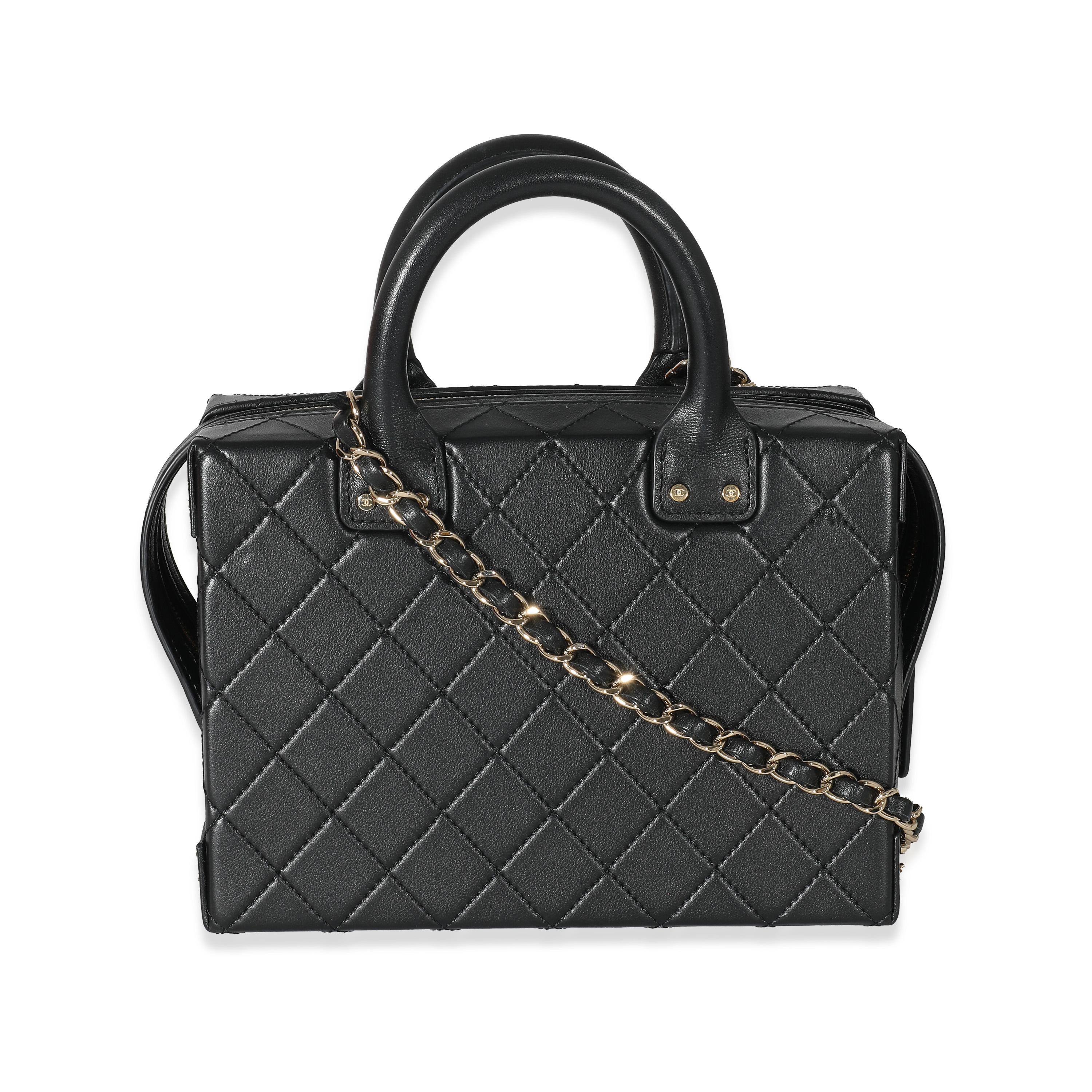Listing Title: Chanel 22B Black Quilted Calfskin Vanity Case
SKU: 133793
Condition: Pre-owned 
Handbag Condition: Excellent
Condition Comments: Item is in excellent condition and displays light signs of wear. Missing zipper pull. Exterior corner