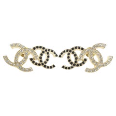 Orecchini Chanel 22B con logo doppia CC in cristallo oro nero 2CK0509