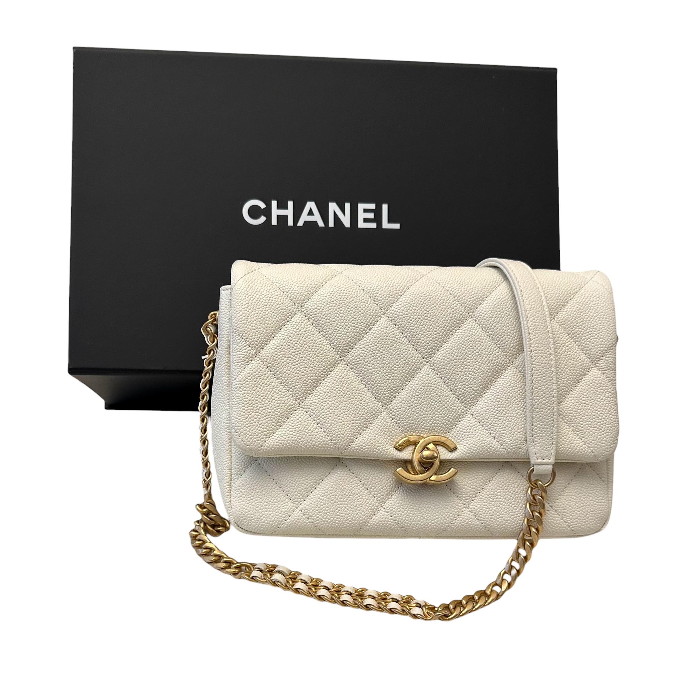 Great piece from the house of Chanel . 
New and in box, this small Melody Flap bag is crafted in the iconic Caviar leather in an off-white color.
It features a front flap with antique gold tone finish CC turnlock and a 3x styles chain shoulder