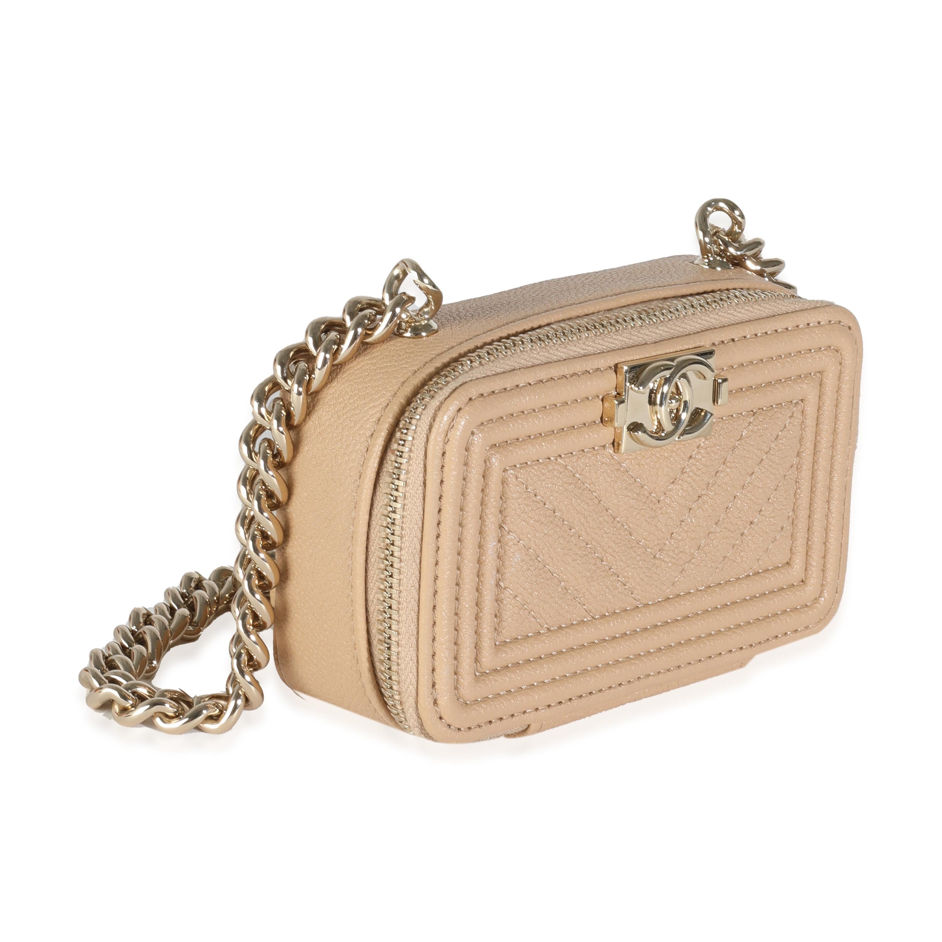 Listing Title: Chanel 22S Beige Caviar Chevron Quilted Mini Boy Clutch With Chain
SKU: 144395
Condition: Pre-owned 
Condition Description: An instant classic, the Boy bag from Chanel was introduced in 2011. The quilted bag was designed by the late