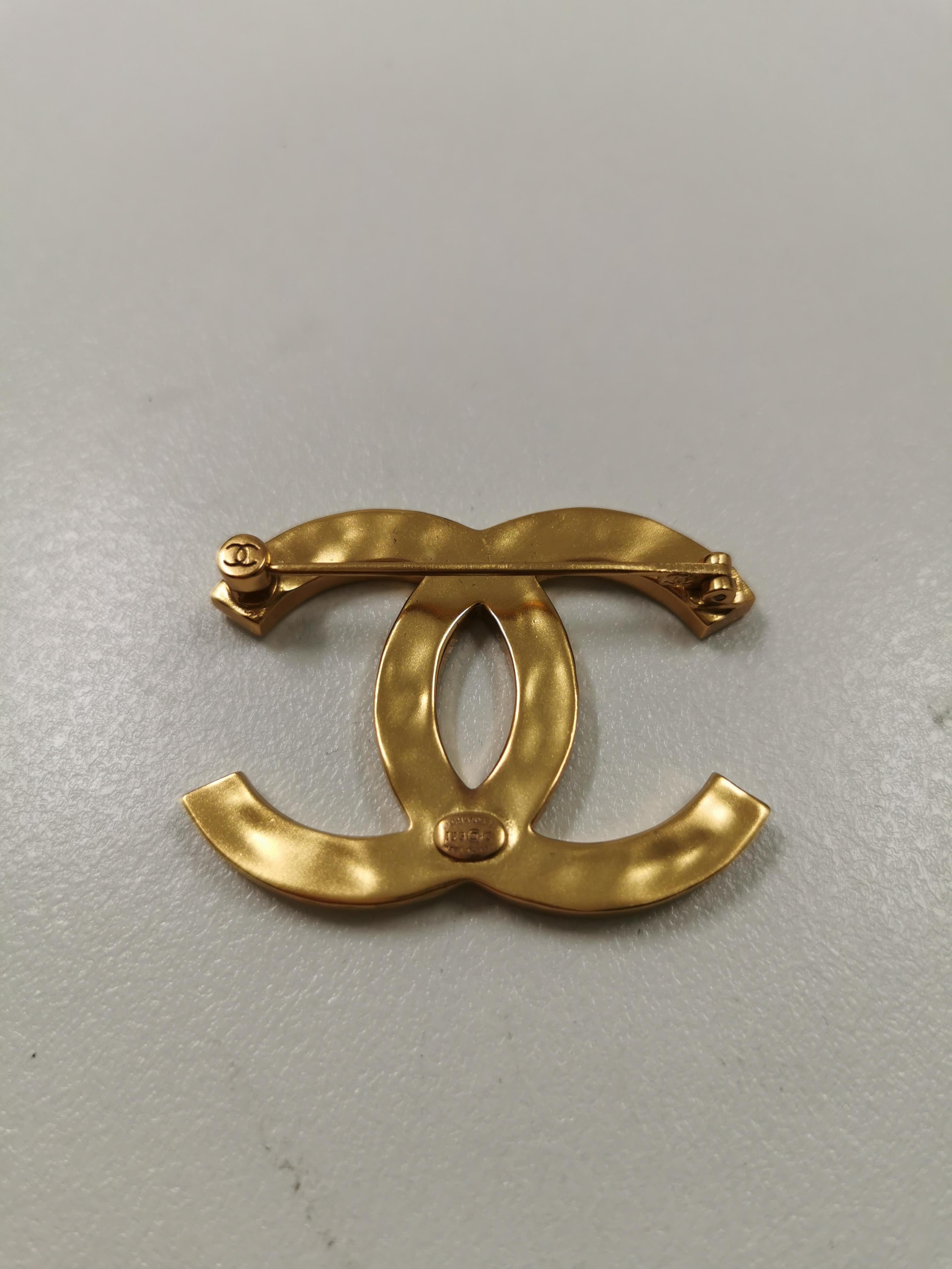 company logo brooch