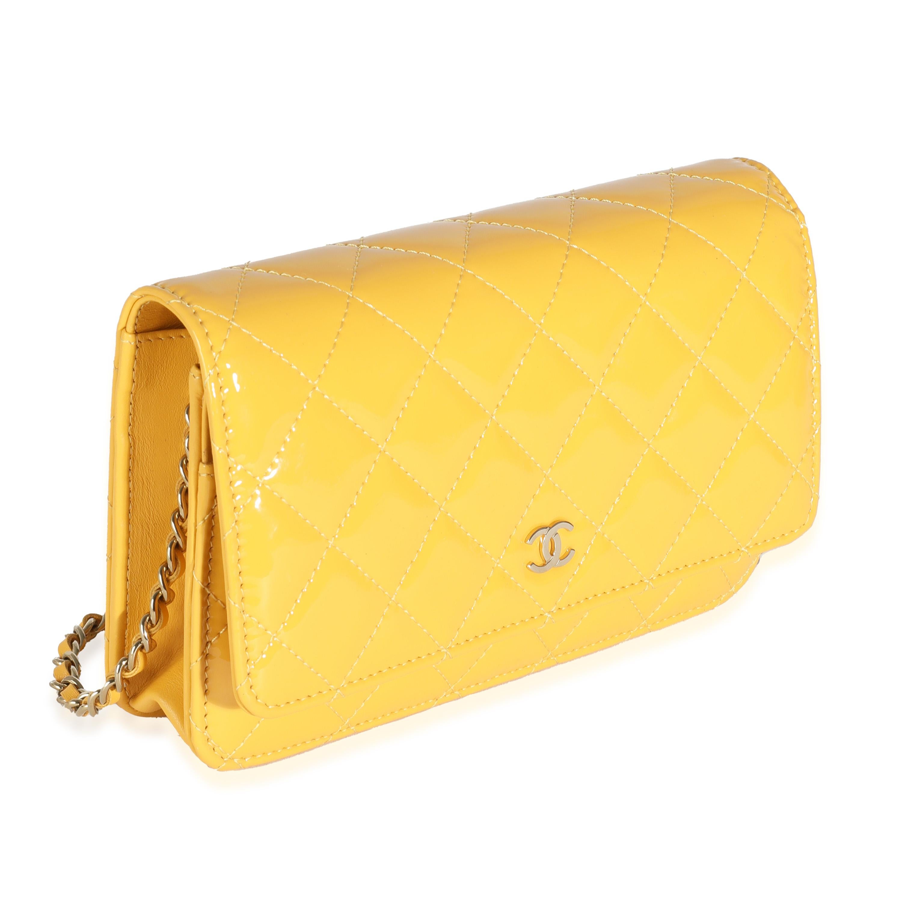 Listing Title: Chanel 23A Yellow Quilted Patent Classic Wallet On Chain
SKU: 144187
MSRP: 3350.00 USD
Condition: Pre-owned 
Handbag Condition: Excellent
Condition Comments: Item is in excellent condition and displays light signs of wear.  Light