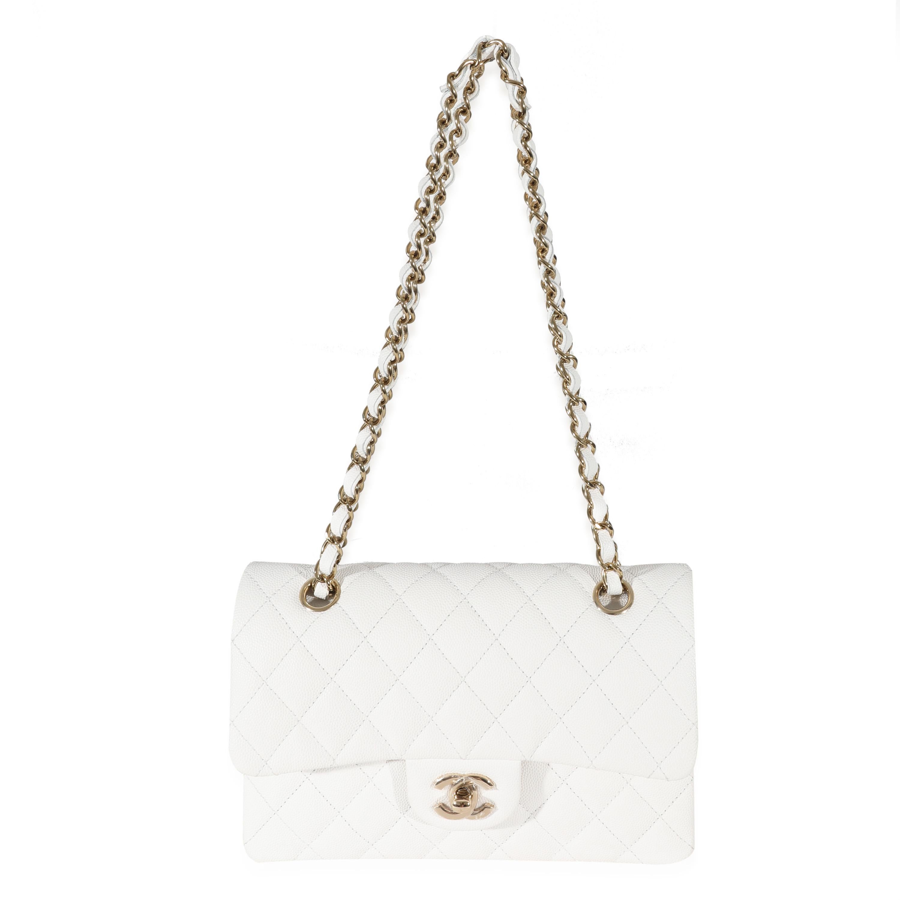 Listing Title: Chanel 23C White Caviar Small Classic Double Flap Bag
SKU: 131333
MSRP: 9600.00
Condition: Pre-owned 
Condition Description: A timeless classic that never goes out of style, the flap bag from Chanel dates back to 1955 and has seen a