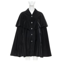 CHANEL 23K Runway black Camellia button cape overlay fluid parka coat FR38 M