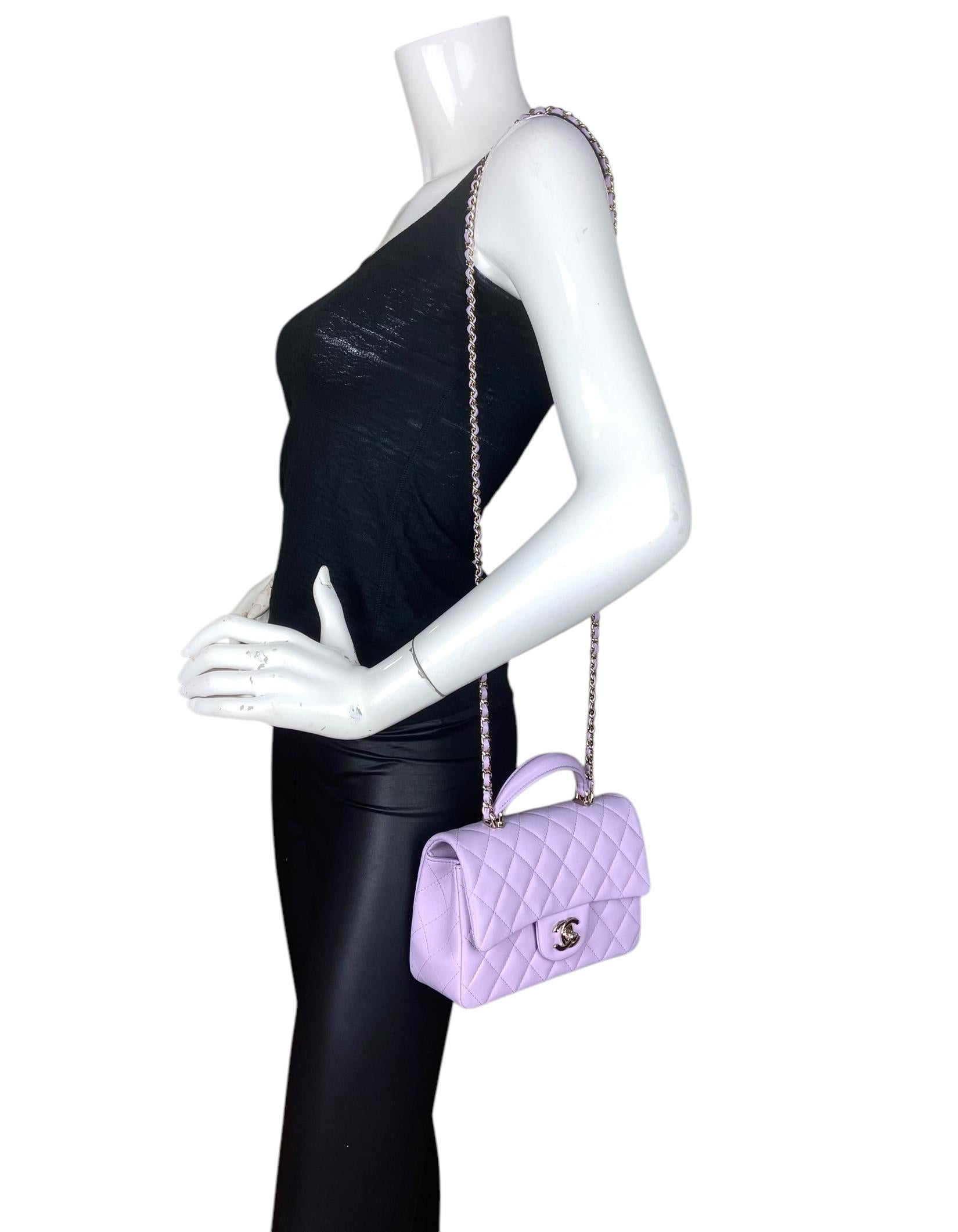 Chanel 2024 Light Purple Lambskin Leather Quilted Mini Top Handle Rectangular Flap

Made In: France
Year of Production: 2024
Color: Light purple
Hardware: Champagne goldtone
Materials: Lambskin leather
Lining: Leather
Closure/Opening: Flap top with