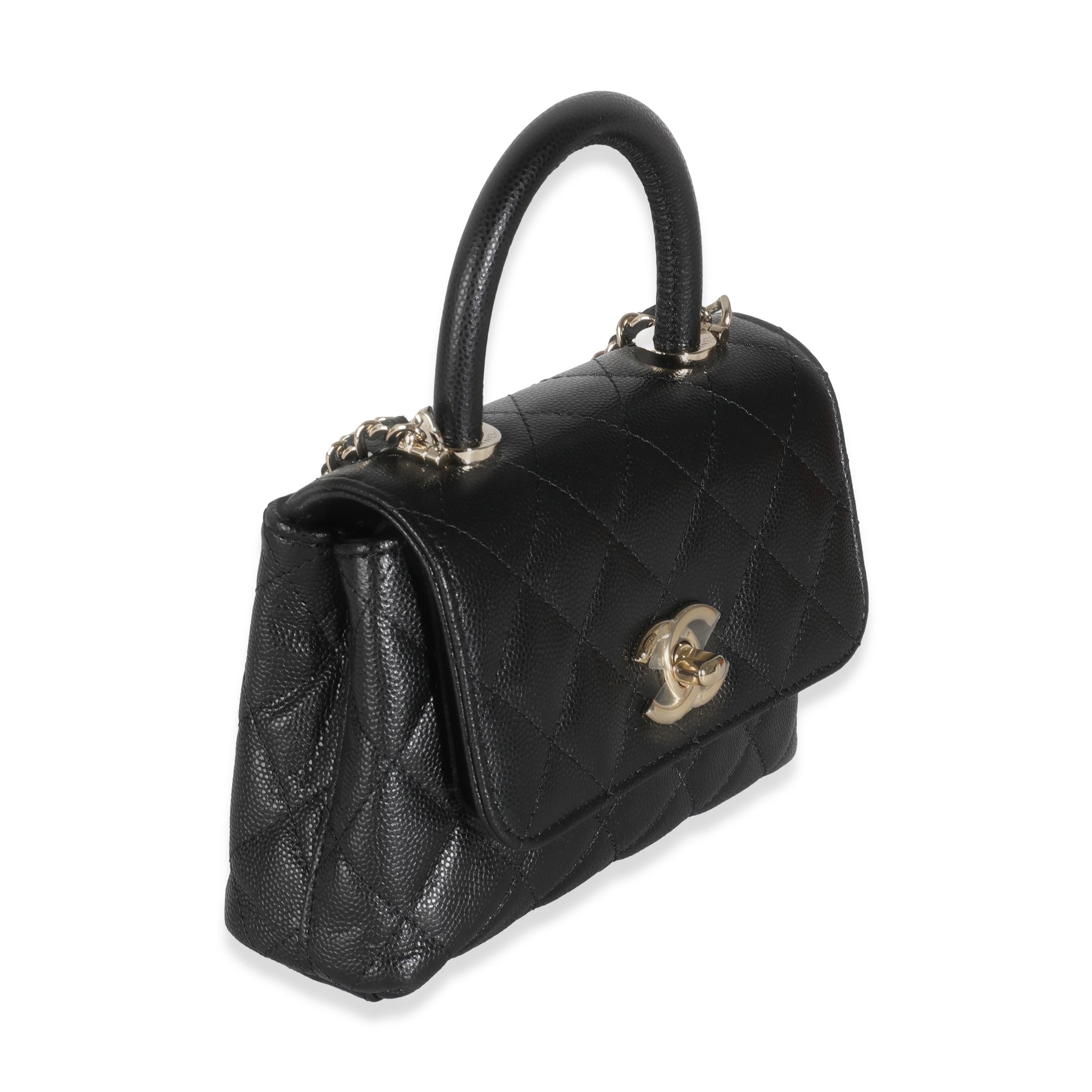 Listing Title: Chanel 24K Black Quilted Caviar Extra Mini Coco Top Handle Bag
SKU: 143569
Condition: Pre-owned 
Condition Description: Intrinsically Chanel, the medium Coco top handle bag was named after the maison's founder. Introduced in 2015, the