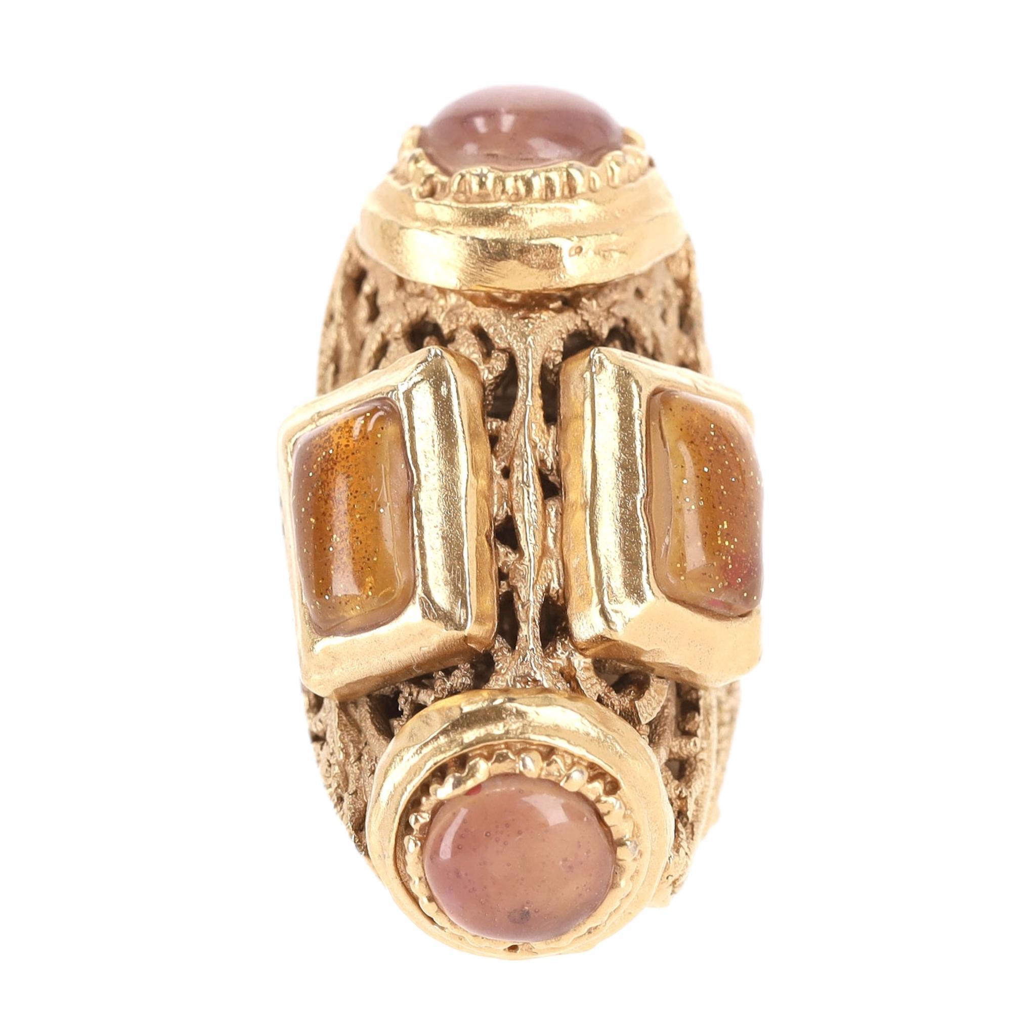 Rare Item - Chanel 24k Gold Plated Gripoix Cabouchon Cruise Collection Ring

Gold setting with filagree cut-out design embellished with two rectangular sparkling gold gripoix stones completed with round, dusty pink pieces.

From 2011 Collection. Rrp