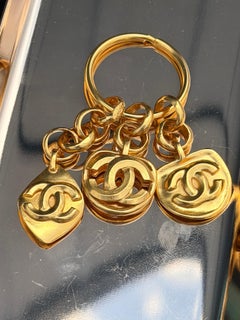 Chanel 24K plated Key Ring featuring 3 Chanel dangling charms