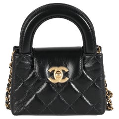 Chanel 24P Nero trapuntato in pelle di vitello invecchiata Mini Nano Kelly Shopper