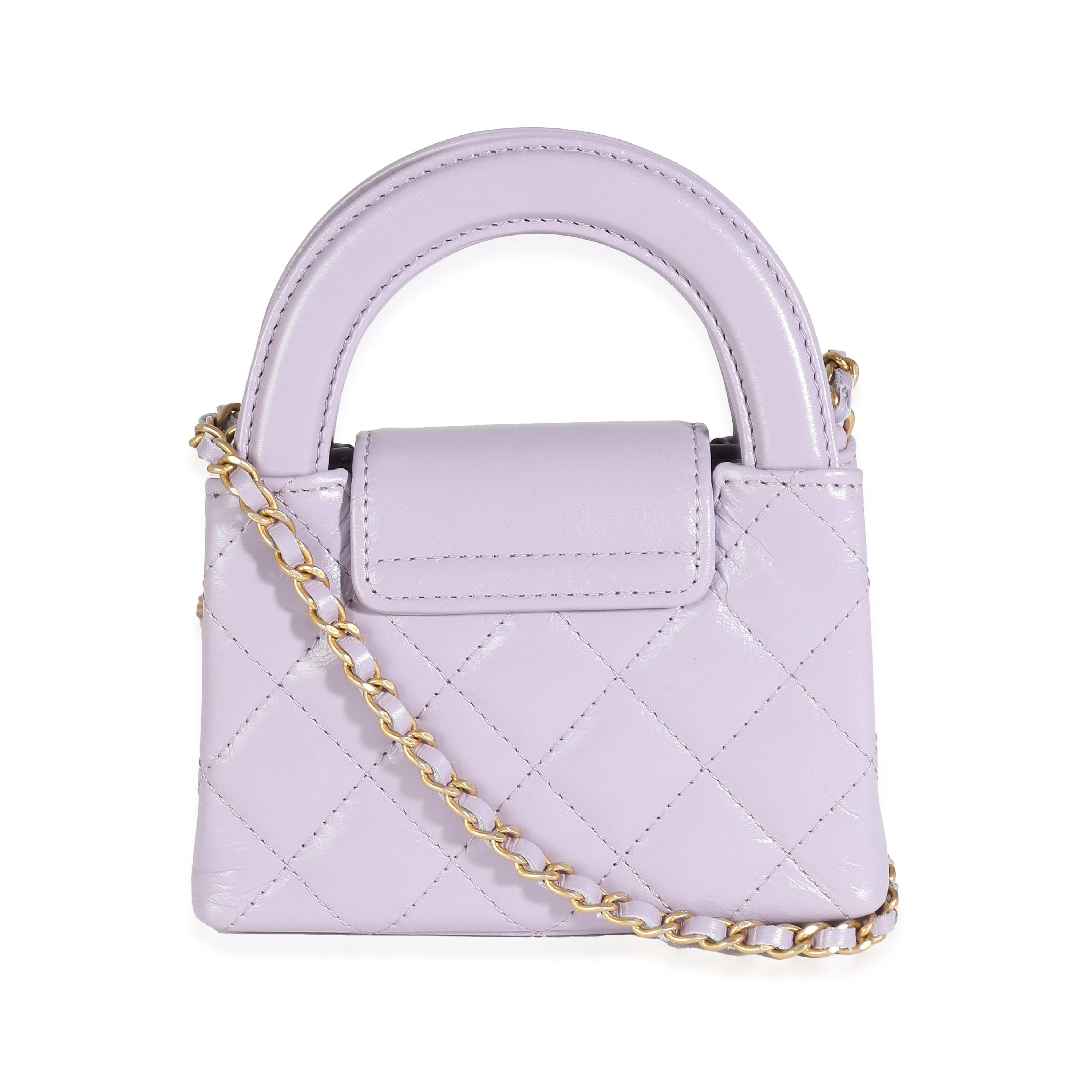 Listing Title: Chanel 24P Light Purple Quilted Shiny Aged Calfskin Mini Nano Kelly Shopper
SKU: 137974
Condition: Pre-owned 
Handbag Condition: Pristine
Condition Comments: Item has no indication of wear. Plastic along hardware.
Brand: Chanel
Model:
