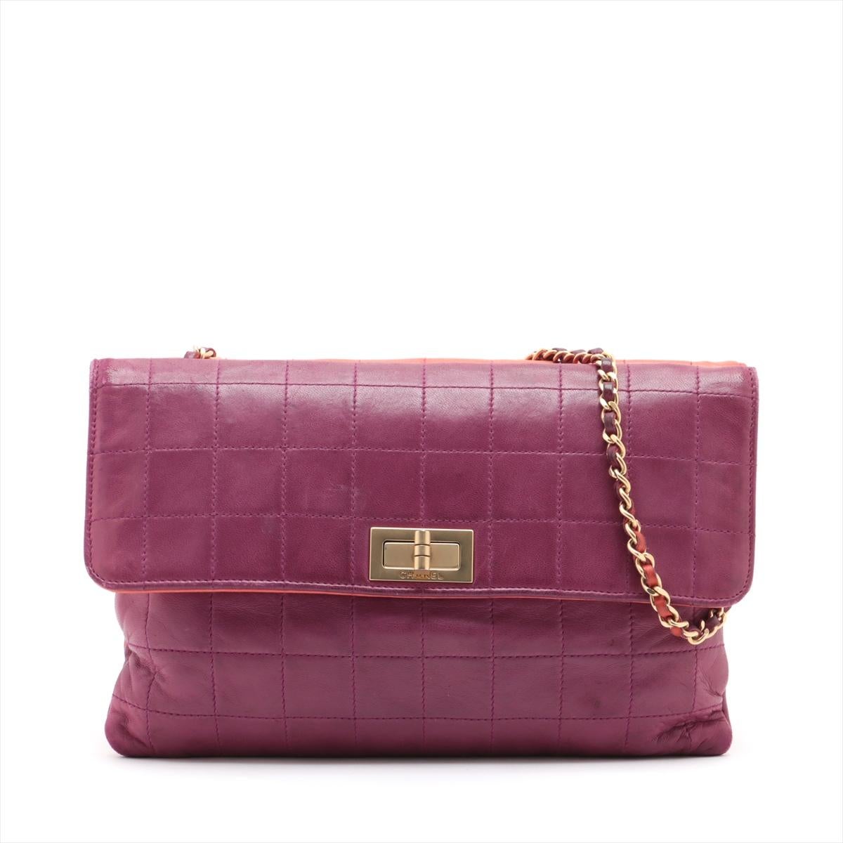 The Chanel 2.55 Chocolate Bar Twin Chain Shoulder Bag in Purple and Orange is a distinctive and stylish accessory that redefines timeless elegance with a bold color palette. Featuring Chanel's iconic chocolate bar quilted design, the bag stands out