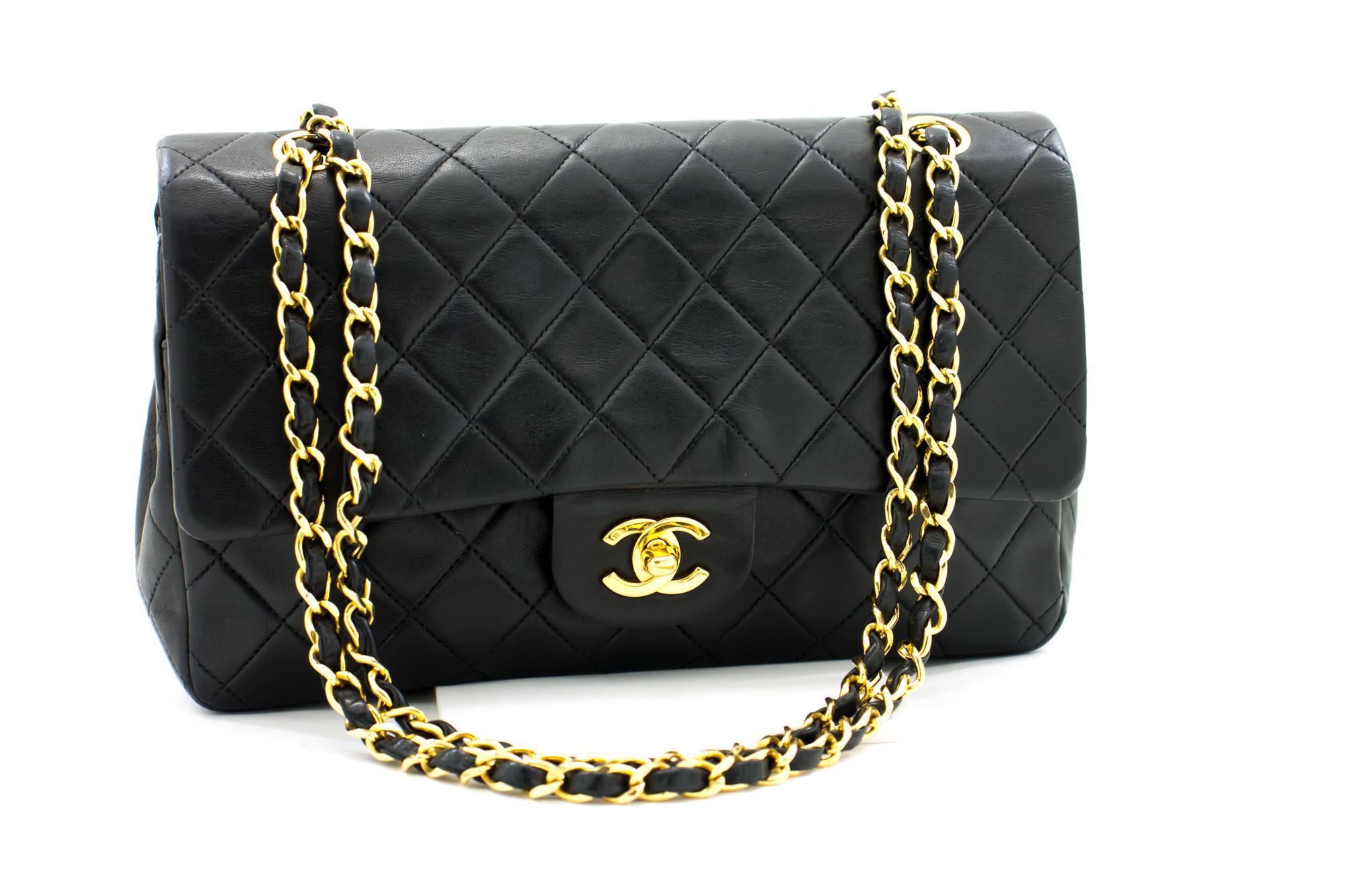 An authentic CHANEL 2.55 Classic Double Flap Chain Shoulder Bag Black made of black Lambskin Handbag. The color is Black. The outside material is Leather. The pattern is Solid. This item is Vintage / Classic. The year of manufacture would be