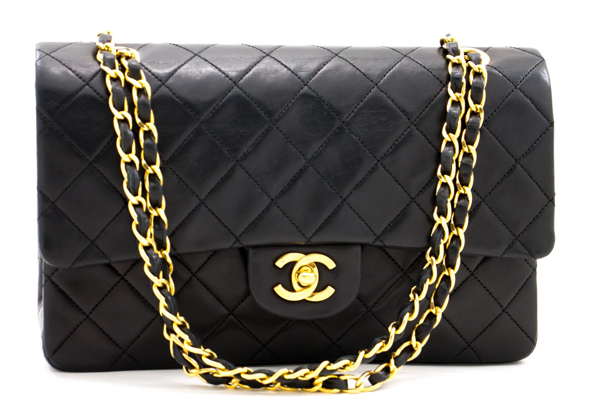 An authentic CHANEL 2.55 Classic Double Flap Medium Chain Shoulder Bag Black made of black Lambskin. The color is Black. The outside material is Leather. The pattern is Solid. This item is Vintage / Classic. The year of manufacture would be