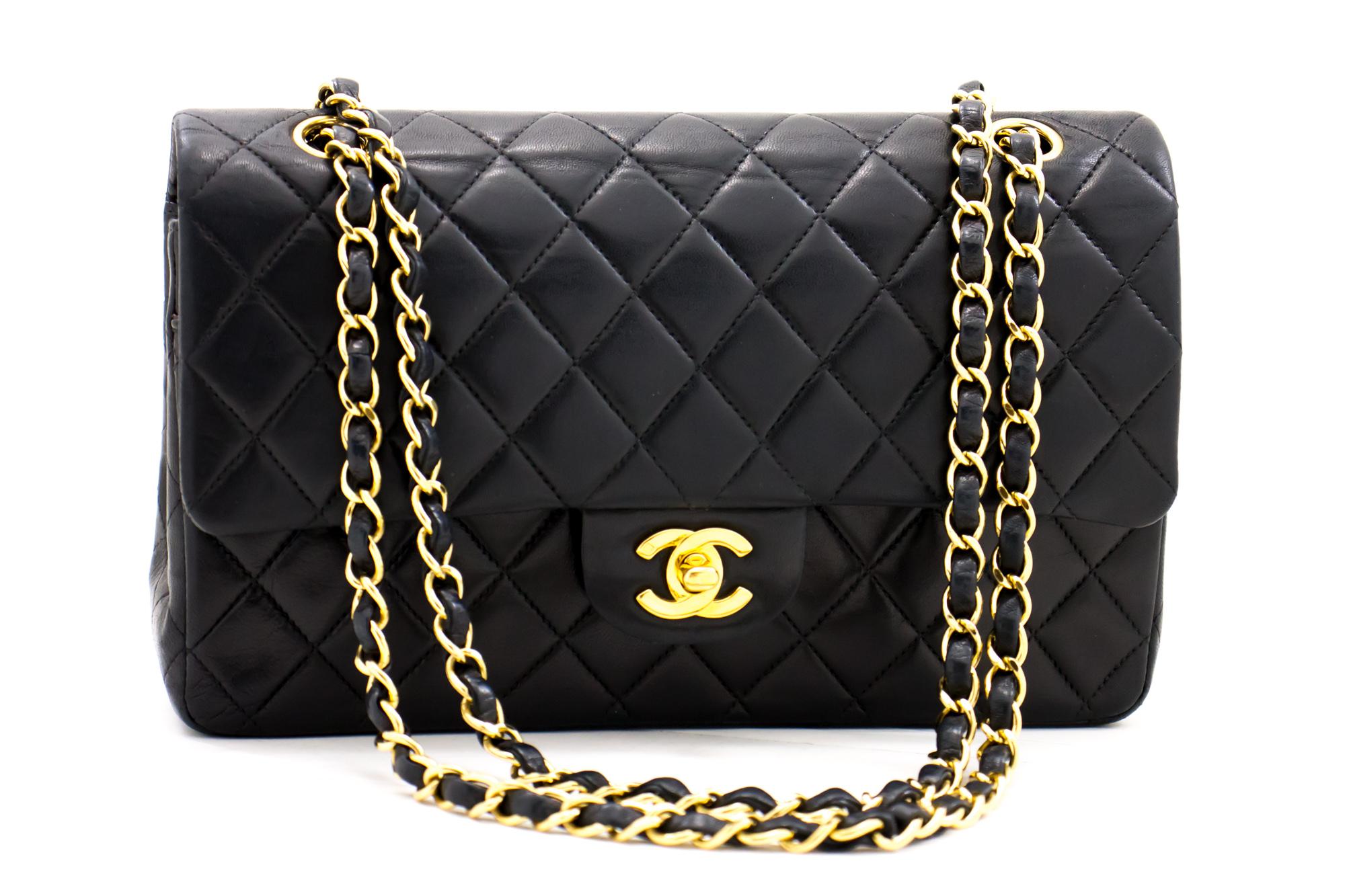 An authentic CHANEL 2.55 Classic Double Flap Medium Chain Shoulder Bag Black made of black Lambskin. The color is Black. The outside material is Leather. The pattern is Solid. This item is Contemporary. The year of manufacture would be 2 0 0 1