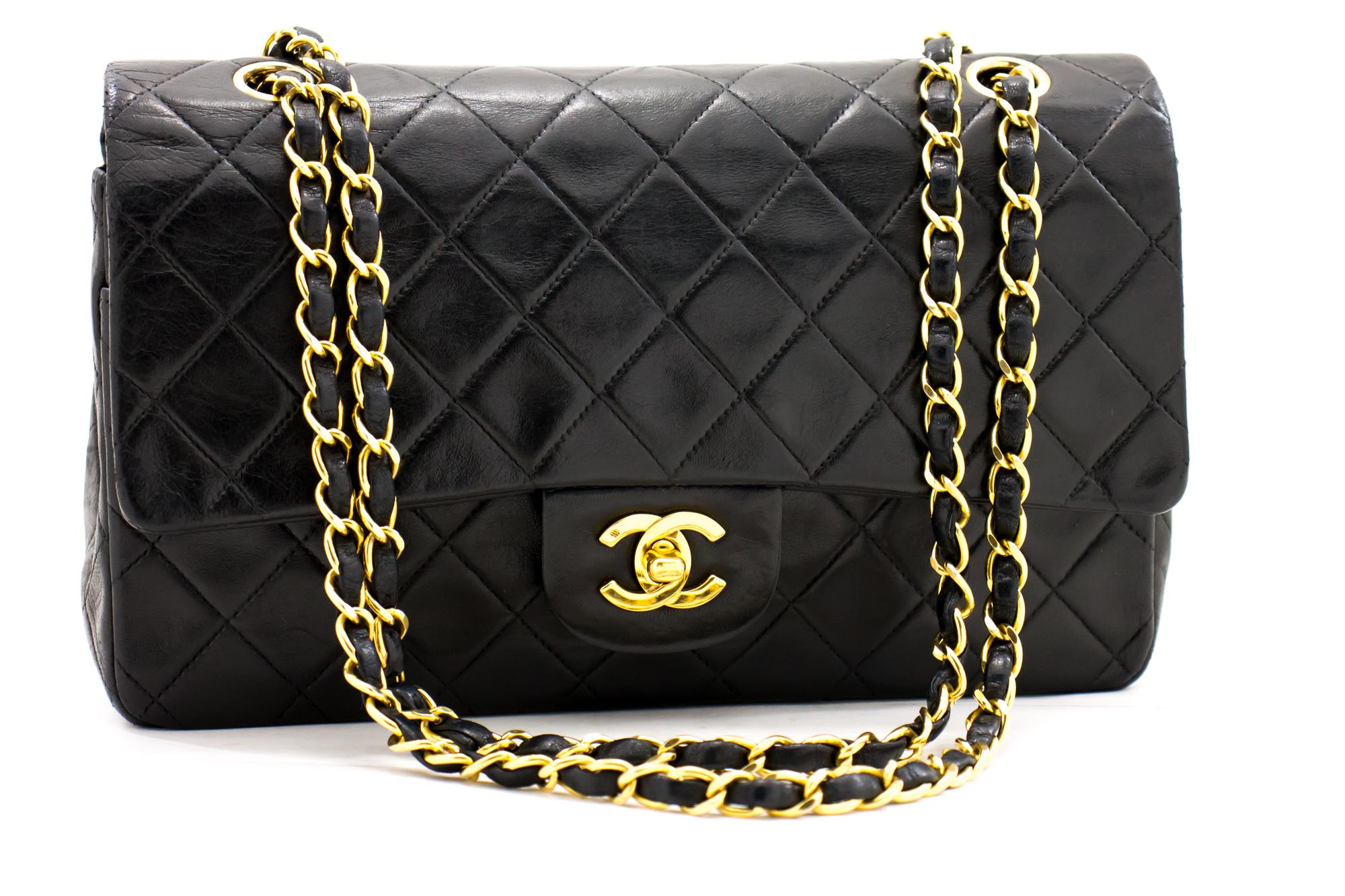 An authentic CHANEL 2.55 Classic Double Flap Medium Chain Shoulder Bag Black made of black Lambskin. The color is Black. The outside material is Leather. The pattern is Solid. This item is Vintage / Classic. The year of manufacture would be