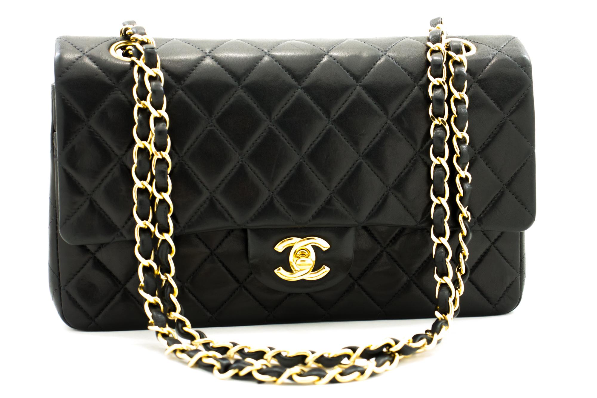 An authentic CHANEL 2.55 Classic Double Flap Medium Chain Shoulder Bag Black made of black Lambskin. The color is Black. The outside material is Leather. The pattern is Solid. This item is Contemporary. The year of manufacture would be 2000-2 0 0 2