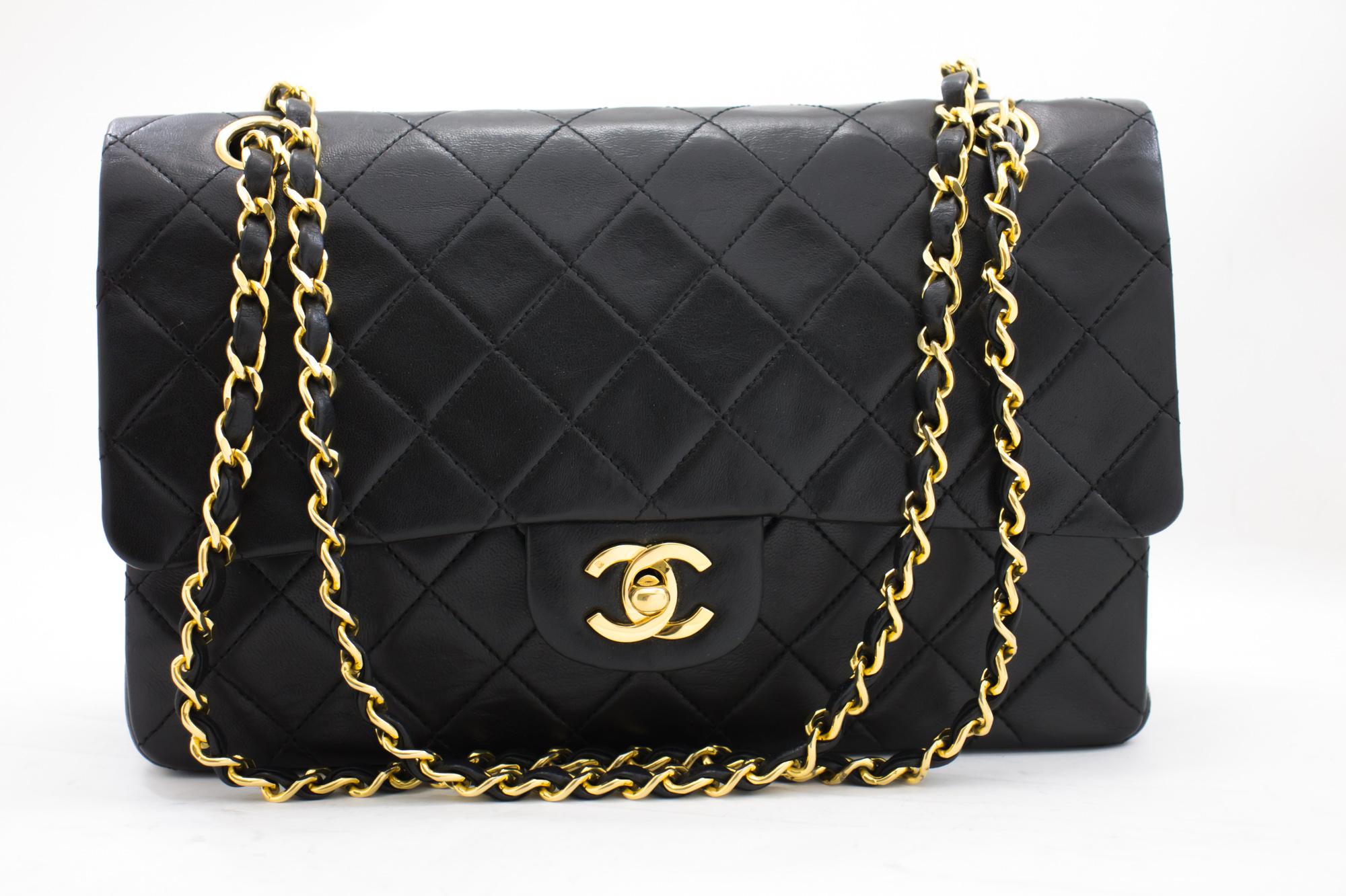 An authentic CHANEL 2.55 Classic Double Flap Medium Chain Shoulder Bag Black made of black Lambskin. The color is Black. The outside material is Leather. The pattern is Solid. This item is Vintage / Classic. The year of manufacture would be