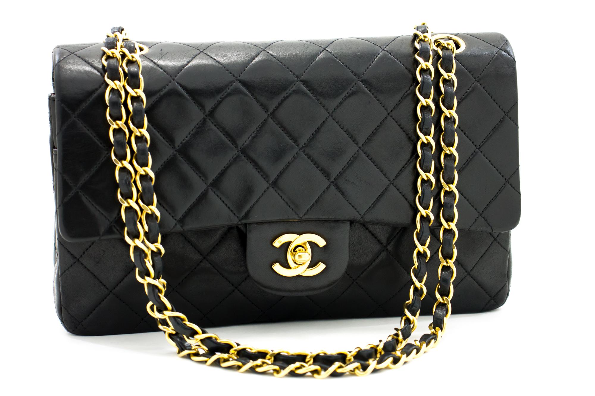 An authentic CHANEL 2.55 Classic Double Flap Medium Chain Shoulder Bag Black made of black Lambskin. The color is Black. The outside material is Leather. The pattern is Solid. This item is Vintage / Classic. The year of manufacture would be