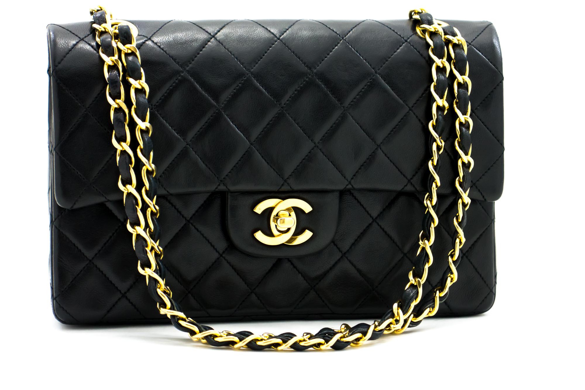 An authentic CHANEL 2.55 Classic Double Flap Small Chain Shoulder Bag Black made of black Lambskin. The color is Black. The outside material is Leather. The pattern is Solid. This item is Vintage / Classic. The year of manufacture would be