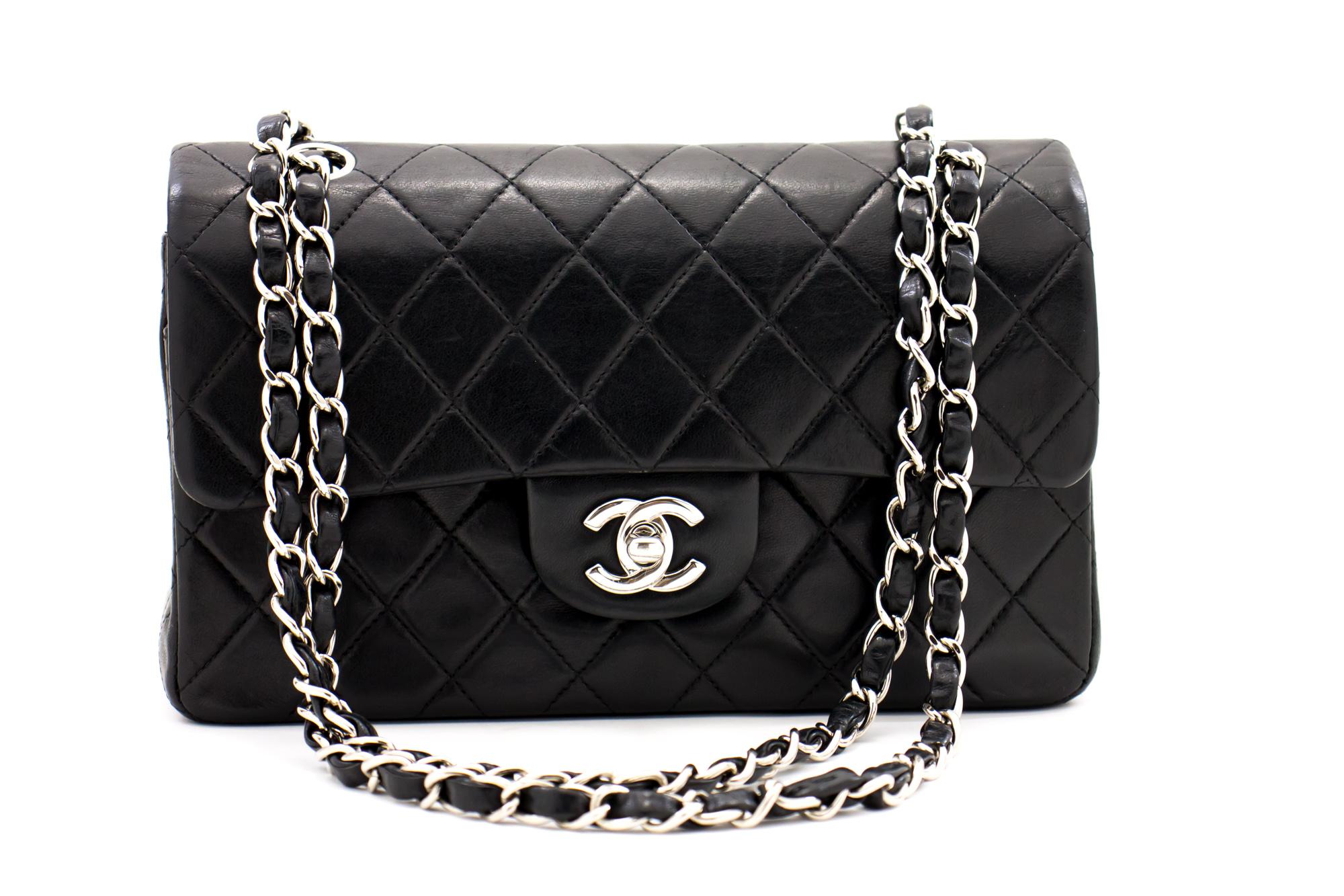 An authentic CHANEL 2.55 Classic Double Flap Small Silver Chain Shoulder Bag Black Lamb. The color is Black. The outside material is Leather. The pattern is Solid. This item is Contemporary. The year of manufacture would be 2000-2 0 0 2 .
Conditions