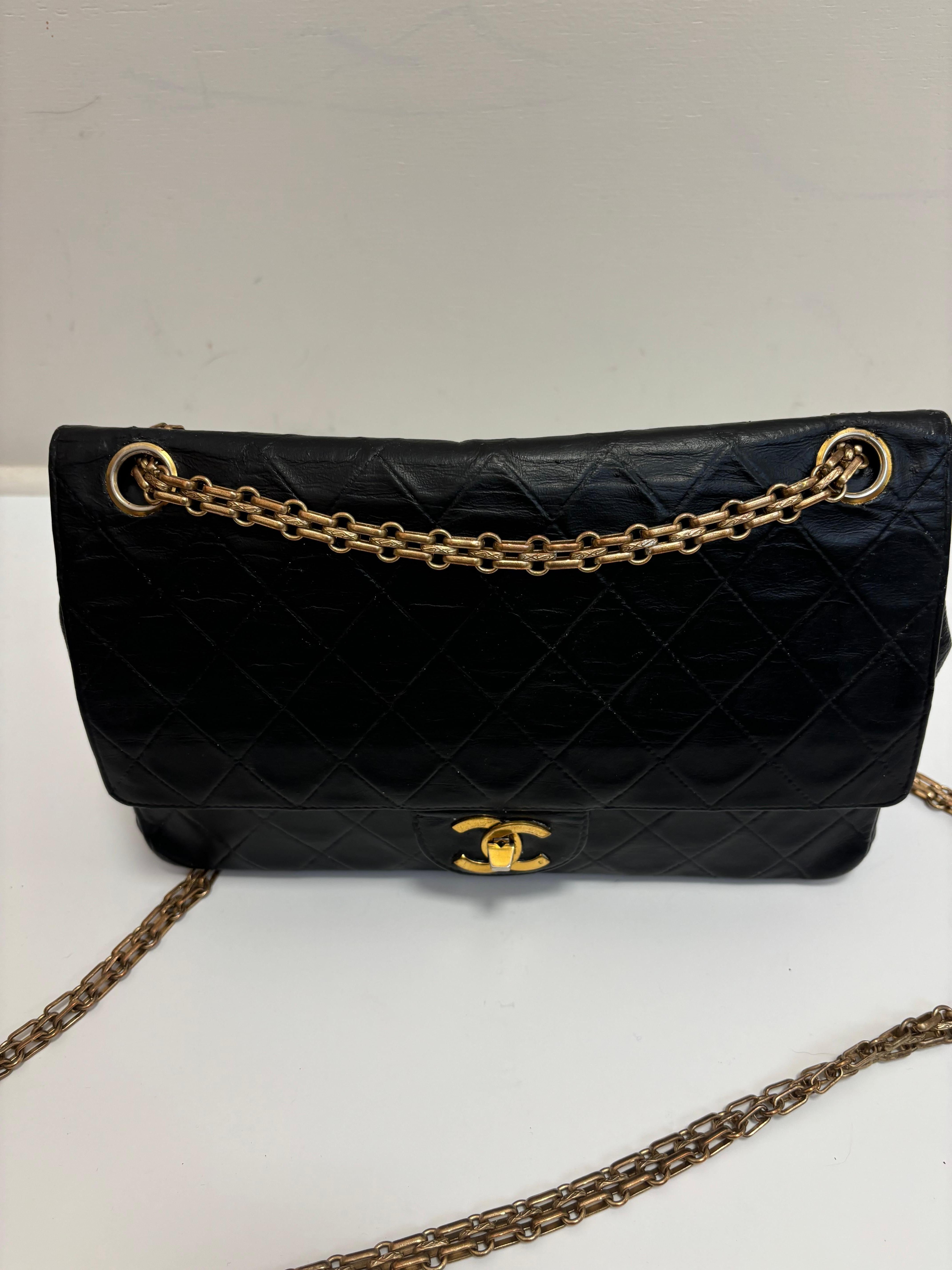 This black 2.55 double flap medium classic bag is made of diamond quilted lambskin leather. 
There is an obvious problem with this bag and that is that it was dyed from white to black. There are some traces of white, mainly on the inside which have