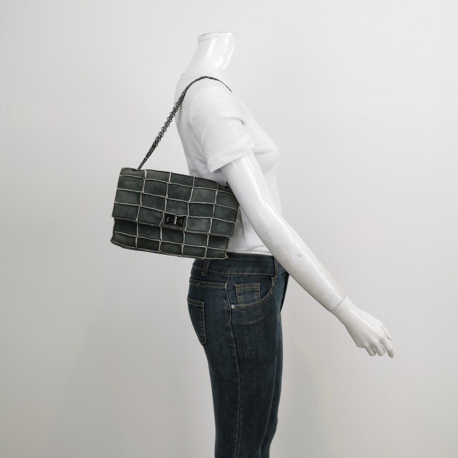 This Chanel 2.55 Flap bag features a mademoiselle turn lock and is made of suede leather, square quilt wild stitch, accented with silver hardware.

CONDITION: Very good condition with moderate signs of wear throughout. Some rubbings around the