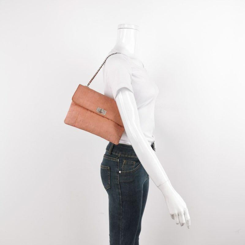 Chanel 2.55 Flap Bag Vintage Chocolate Bar Small Suede Coral Pink, 2000-2002
These are professional photos of the actual bag.
  This Chanel 2.55 Flap bag features a mademoiselle turn lock and is made of suede leather, square quilt wild stitch,