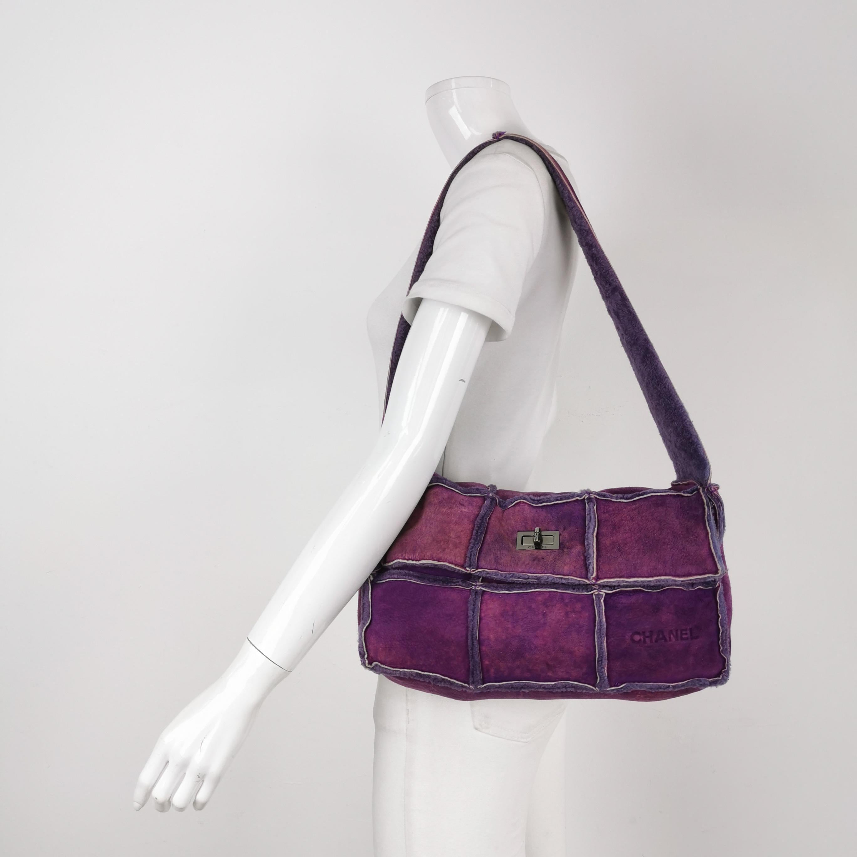 This Chanel 2.55 Flap bag features a mademoiselle turn lock and is made of suede leather, square quilt wild stitch, accented with silver hardware.

CONDITION: Very good condition with moderate signs of wear throughout. Some rubbings around the